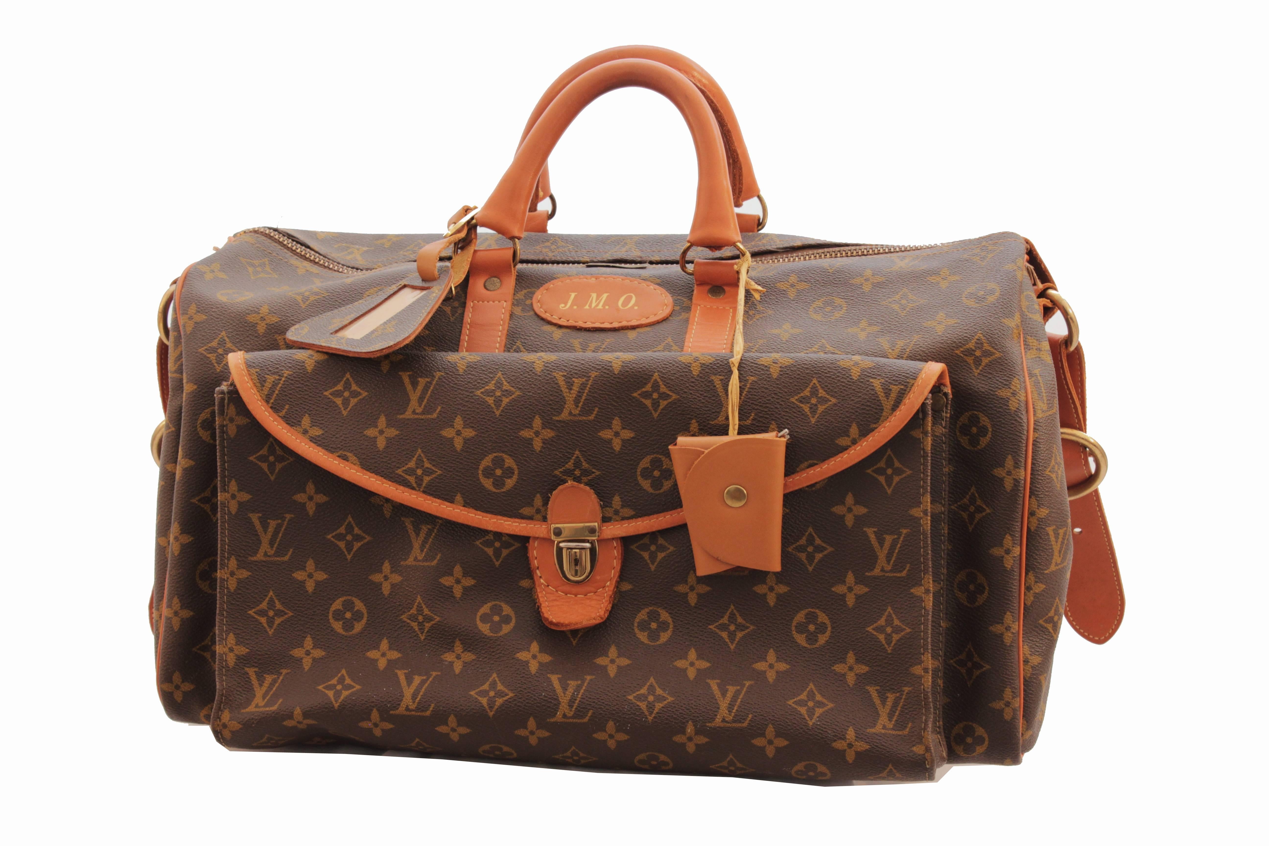 Here's an opportunity to own a very unique and very RARE vintage bag from Louis Vuitton by The French Company, most likely made in the late 1970s.  Sold by Saks 5th Avenue, this large duffel or tote bag is ideal for travel and features a large main