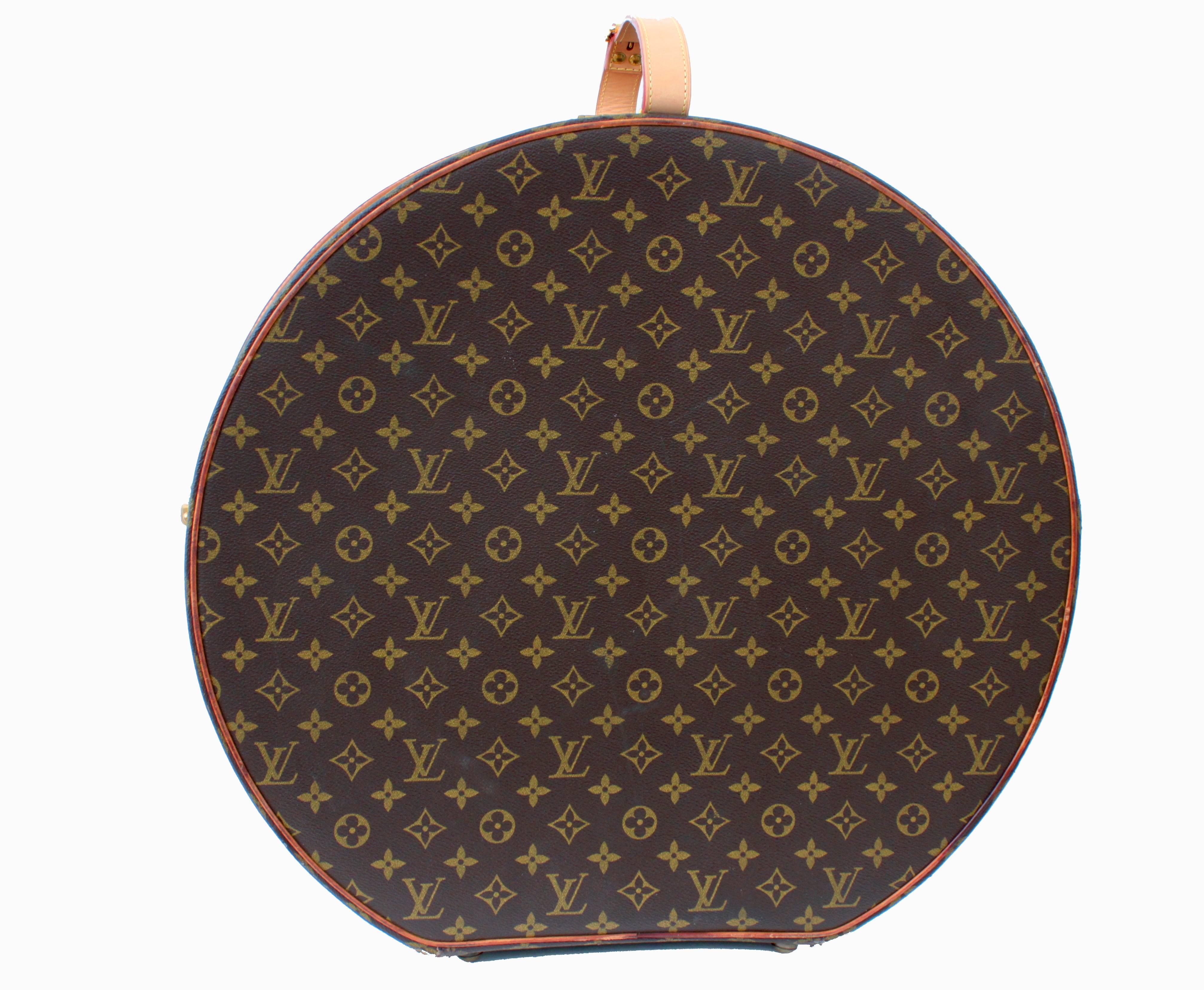 Travel in style with this incredible Louis Vuitton Monogram Boite Chapeaux hat box, made in the late 1970s.  This is the 50cm size, which measures 19.68in H x 20in W x 8in D and fastens with two side latches and one push lock on the front.  Note