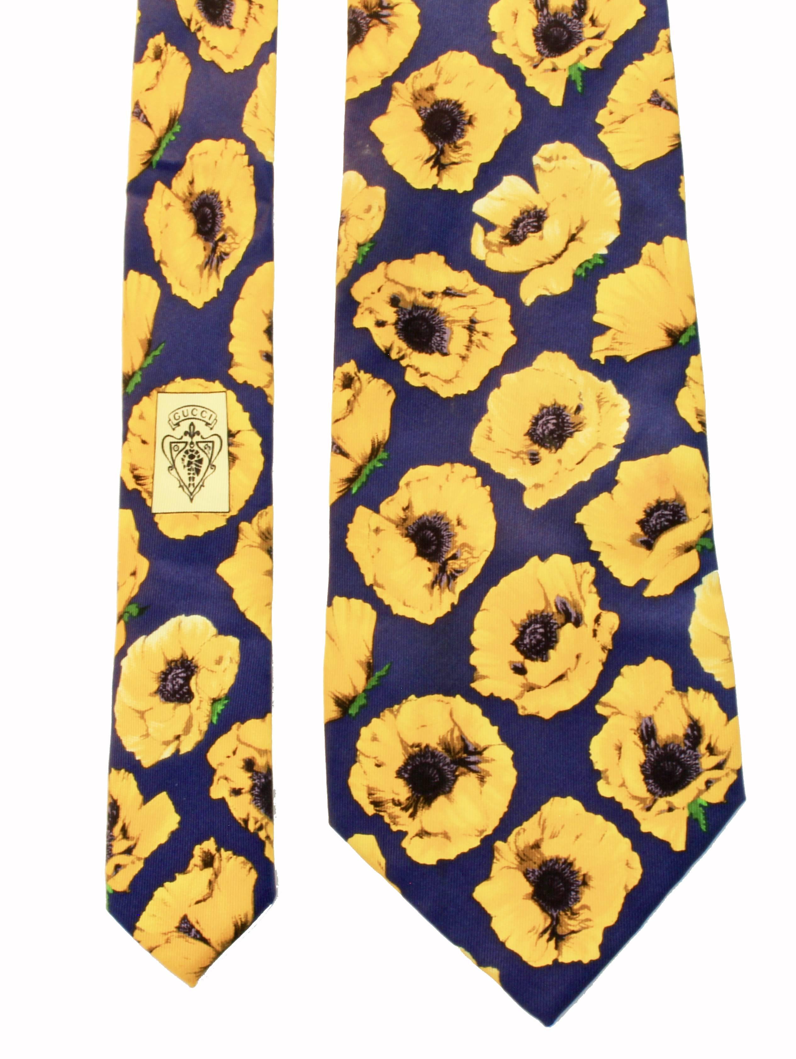 Here's a bold graphic print tie from Gucci.  Made from 100% silk and in excellent preowned condition overall, we note one small spot (see last image, where we've circled in red).  We suspect this will come out with a trip to the cleaners, and our