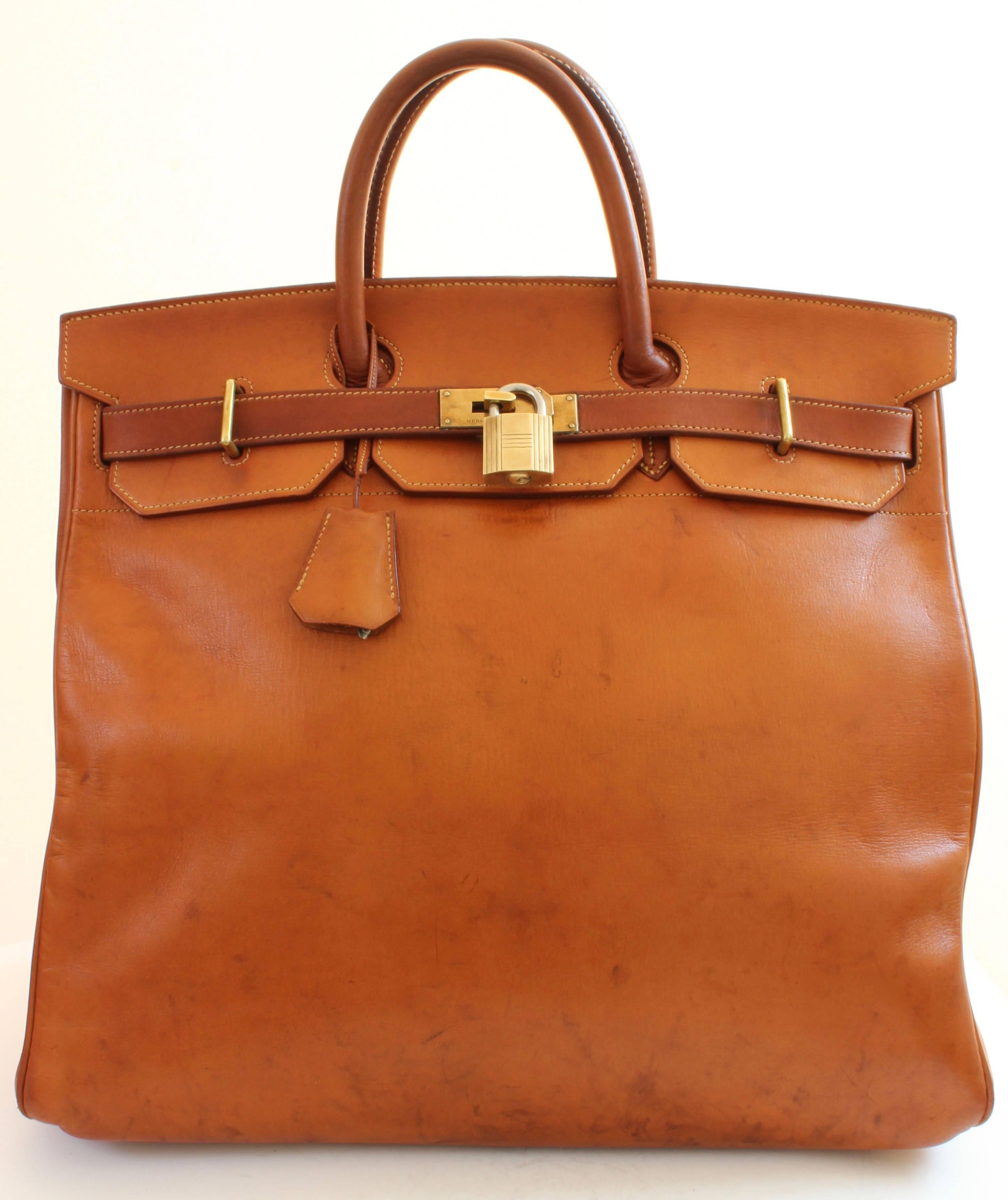 This iconic travel bag was made by Hermes in the 1970s and is one of our favorites!  Coined the Haut a Courroies or HAC, this is the 45cm version and is made from a pretty rare Hermes saddle leather called Veau Grain Long - discontinued years ago