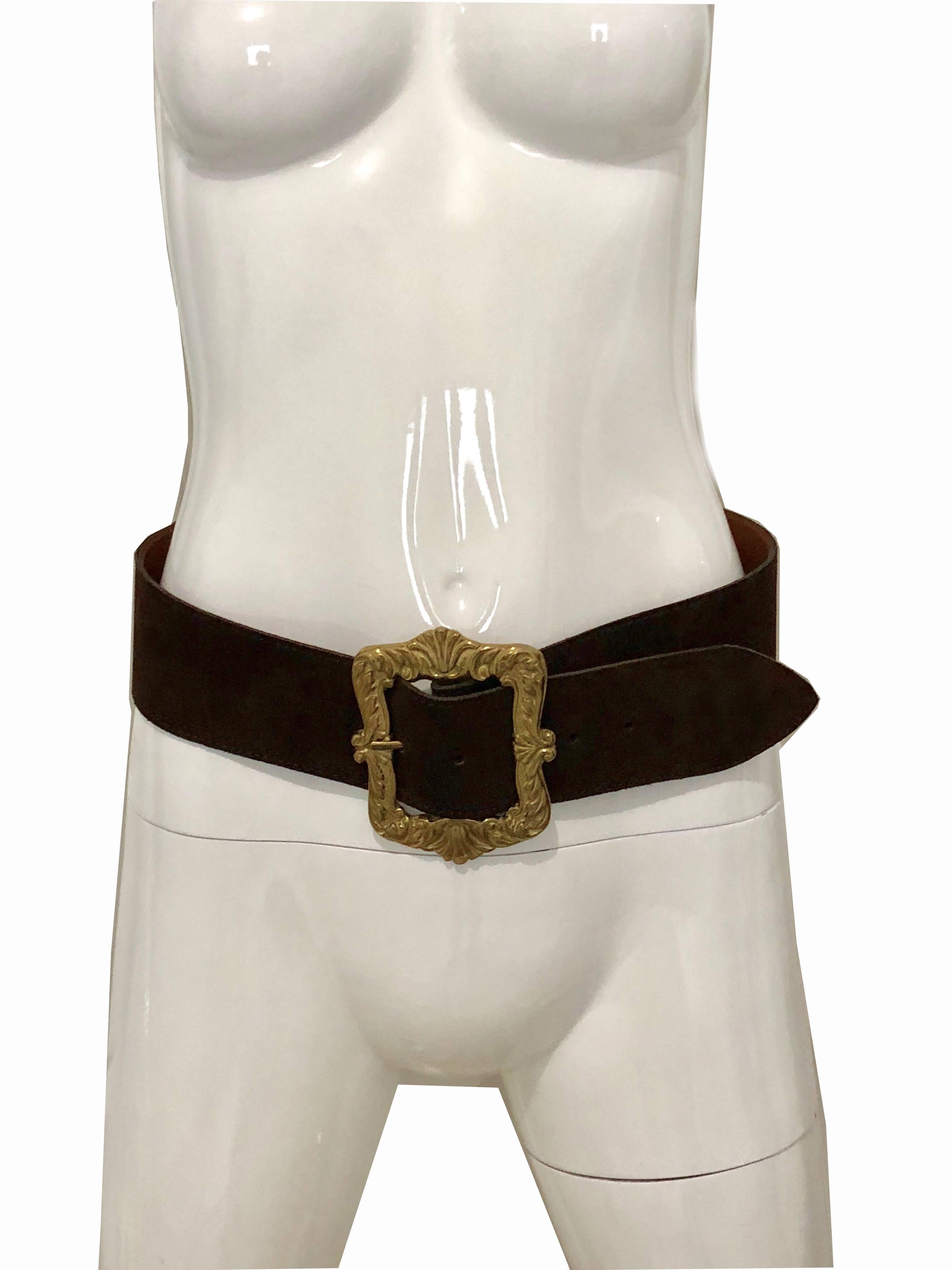 This brown suede leather belt was made by Mulberry Company, England.  It features an oversized gold metal buckle and extra wide 2.2in brown suede belt strap.  It measures a  total length of 37in and best fits a waist between 30in and 33in.  In good