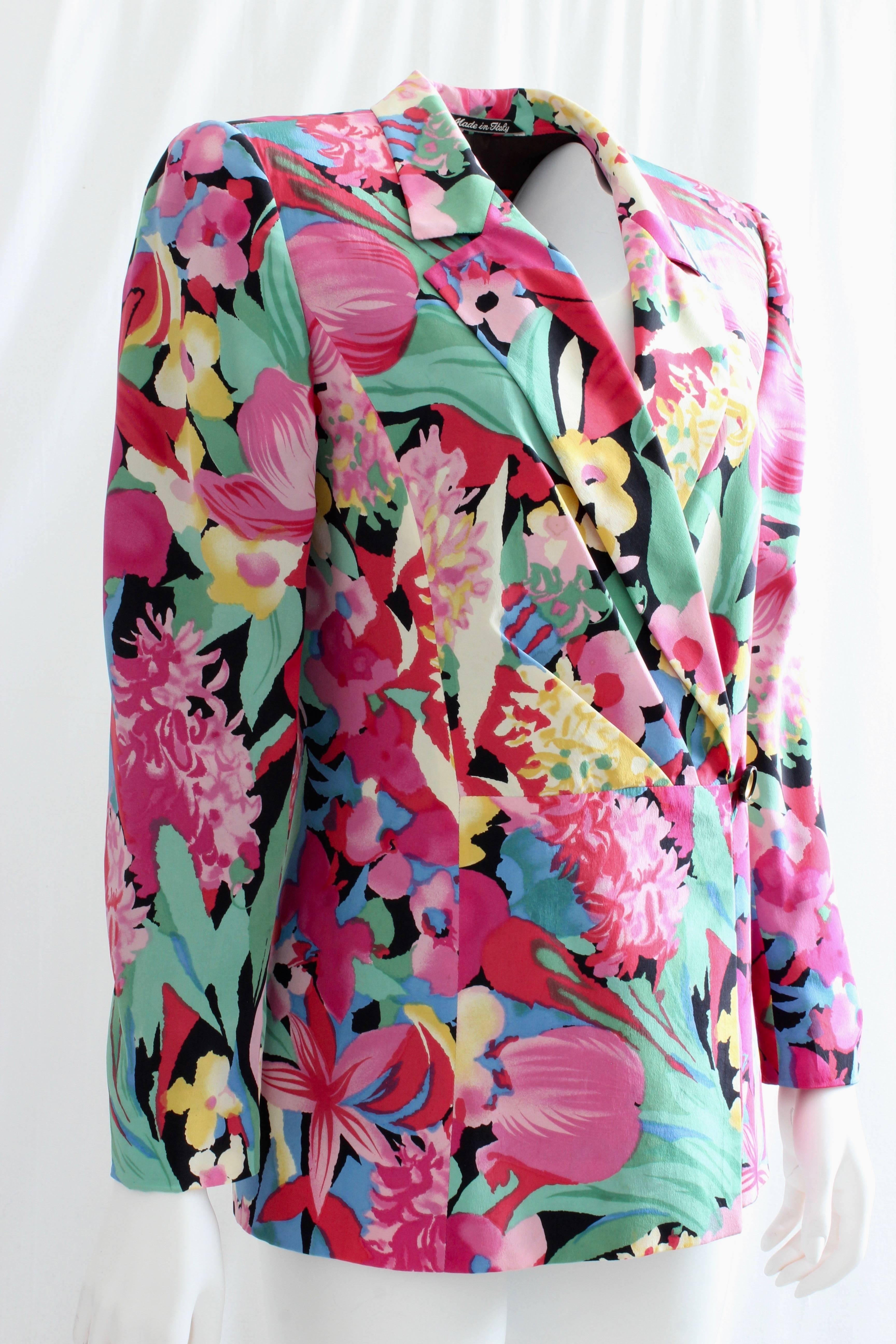 This colorful silk jacket was made by Ungaro for their Solo Donna collection, most likely in the 1990s.  Made from a gorgeous abstract floral print, it's fully-lined and features a pleated front panel.  In very good condition for its age, we note