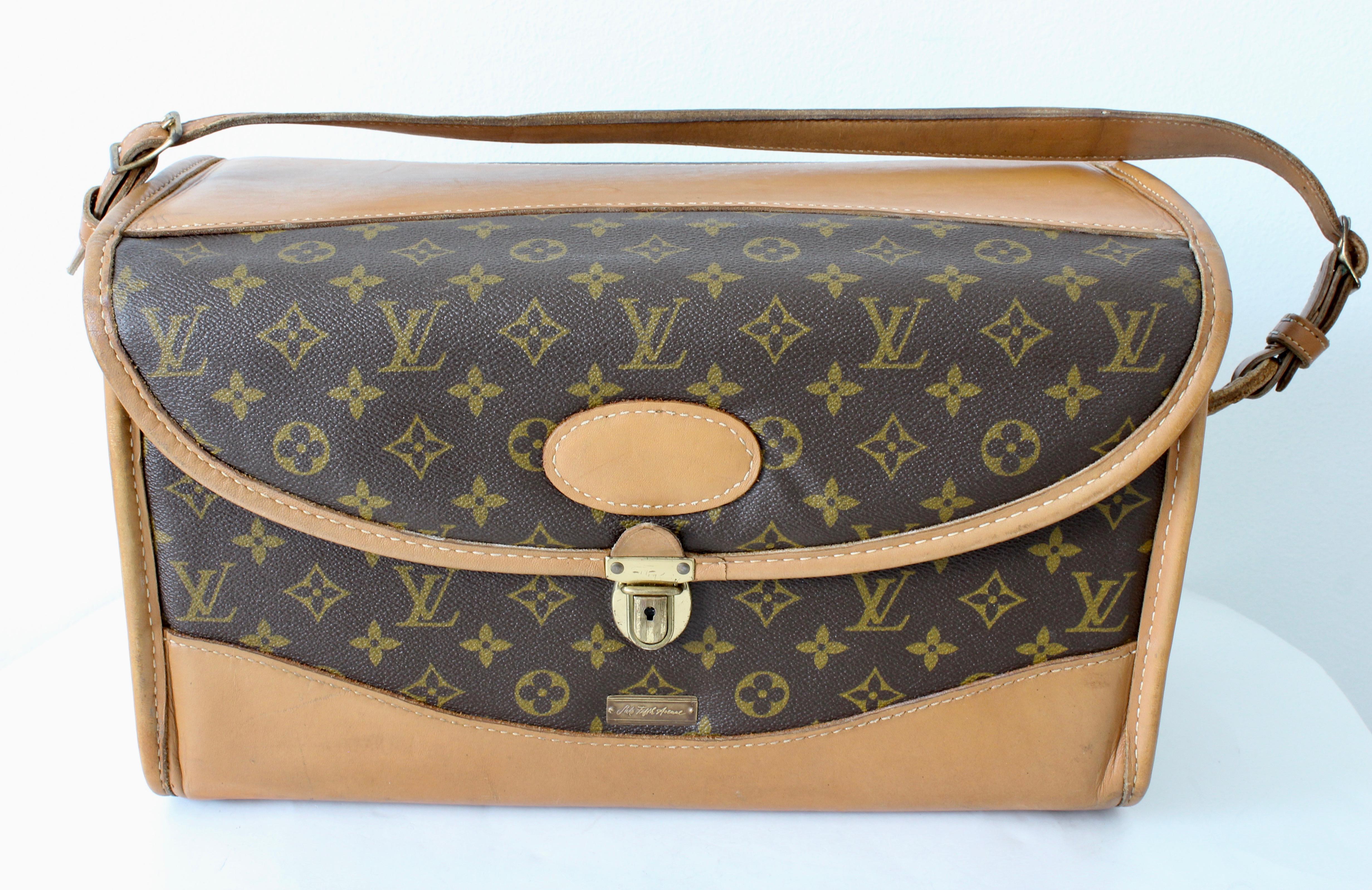 This fabulous train case or vanity was made by The French Company for Louis Vuitton and sold by Saks 5th Avenue, most likely in the mid 1970s.  Made from their signature monogram canvas, its trimmed in coated leather, features a leather patch for