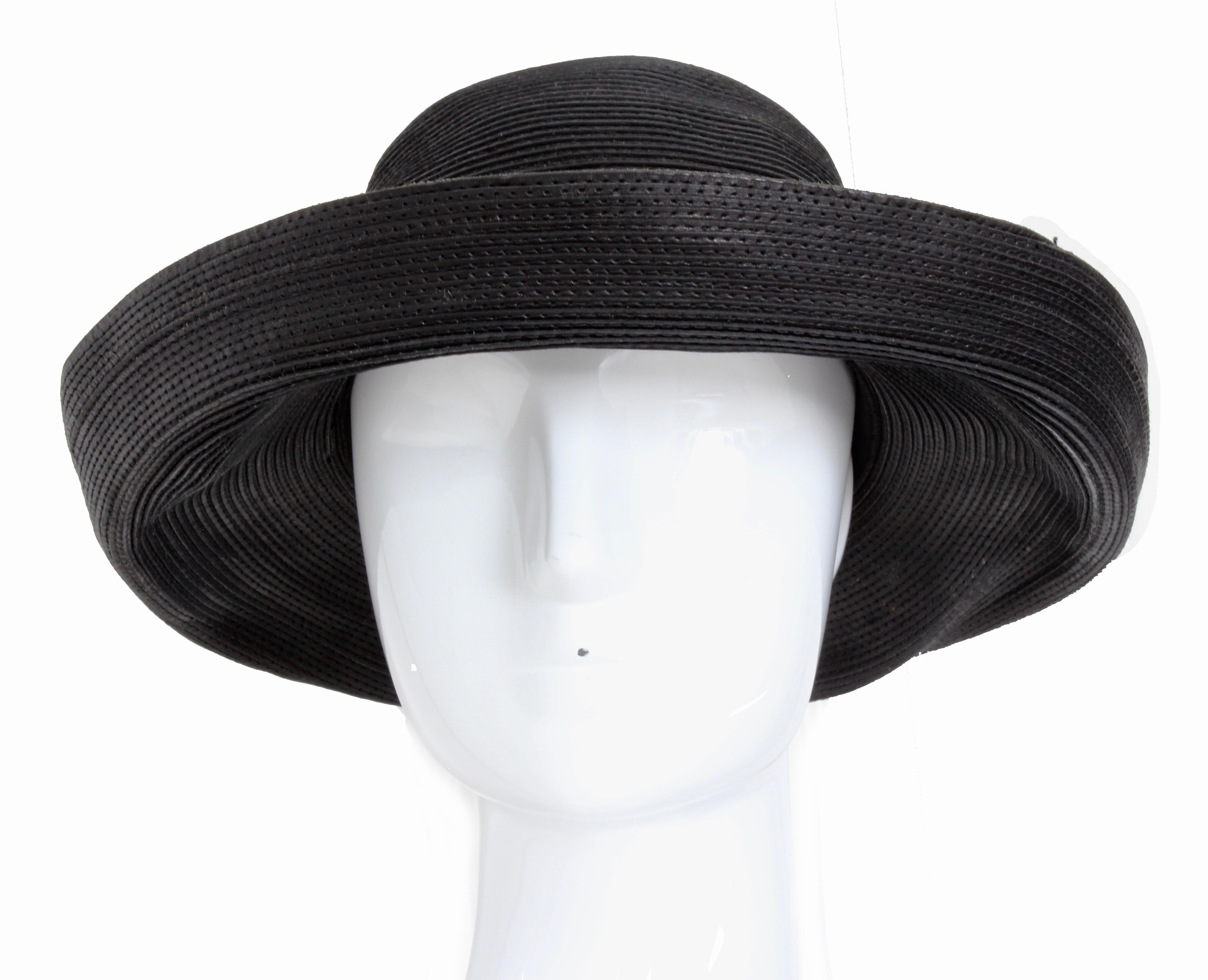 Here's a cool corded leather hat from Patricia Underwood, most likely made in the 1980s.  It features a wide 3.5in  floppy brim allowing one to style in several ways. In very good preowned condition with minimal signs of prior wear. No size tag, but