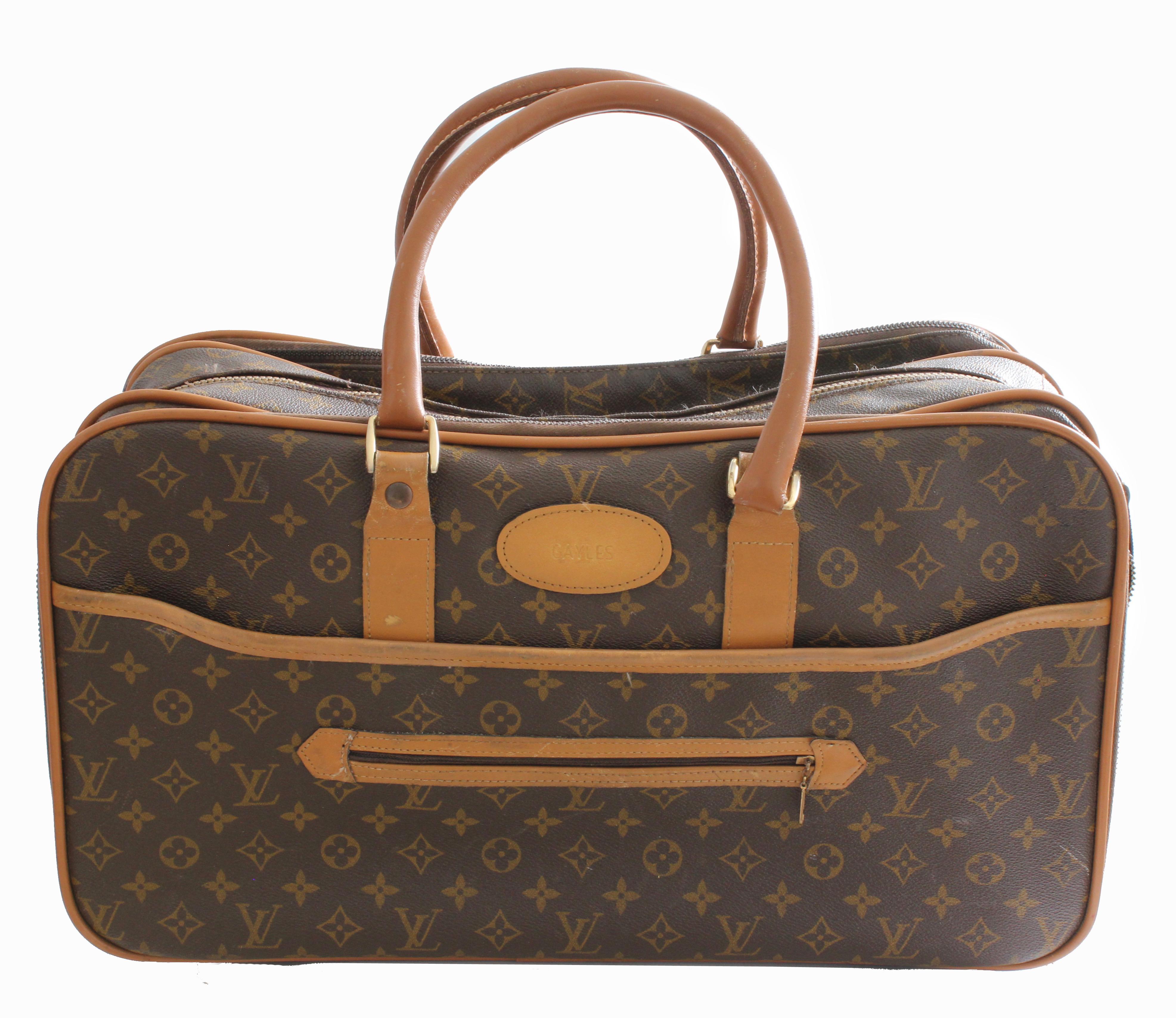 Here's a hard-to-find soft side suitcase or carry all was made in the 1970s by The French Company for Louis Vuitton and Saks Fifth Avenue. Produced for only a short period, these incredible French Company pieces are so hard to find nowadays and are