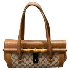 1990s Gucci monogram shoulder bag with bamboo detail