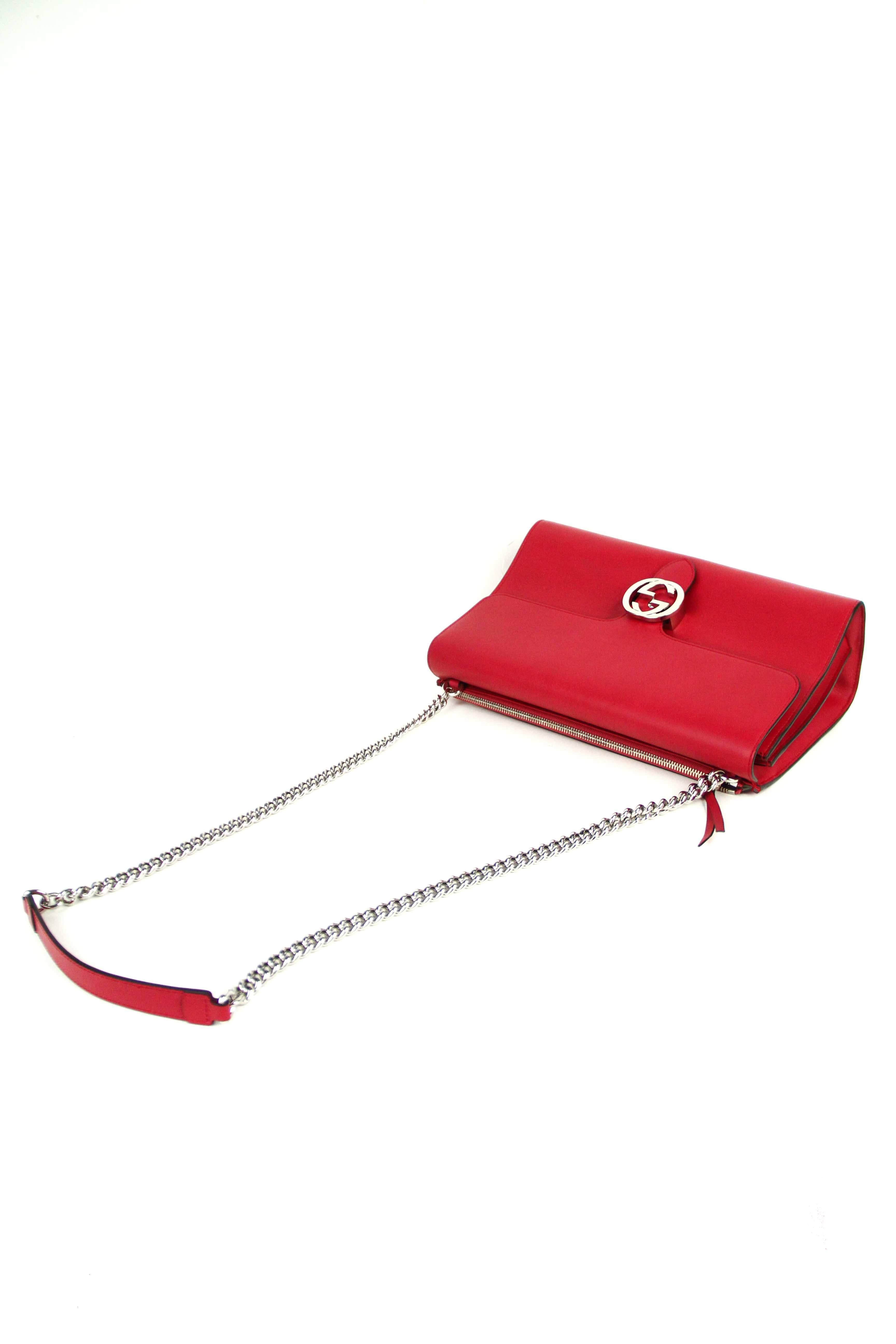 Offered is a new pre-owned never used Gucci Linea B handbag in supple red calfskin. Silver tone chain handles with flat leather at shoulders , and interlocking  GG logo clasp on front tab.  Interior slips pockets and zip pocket, with a full length