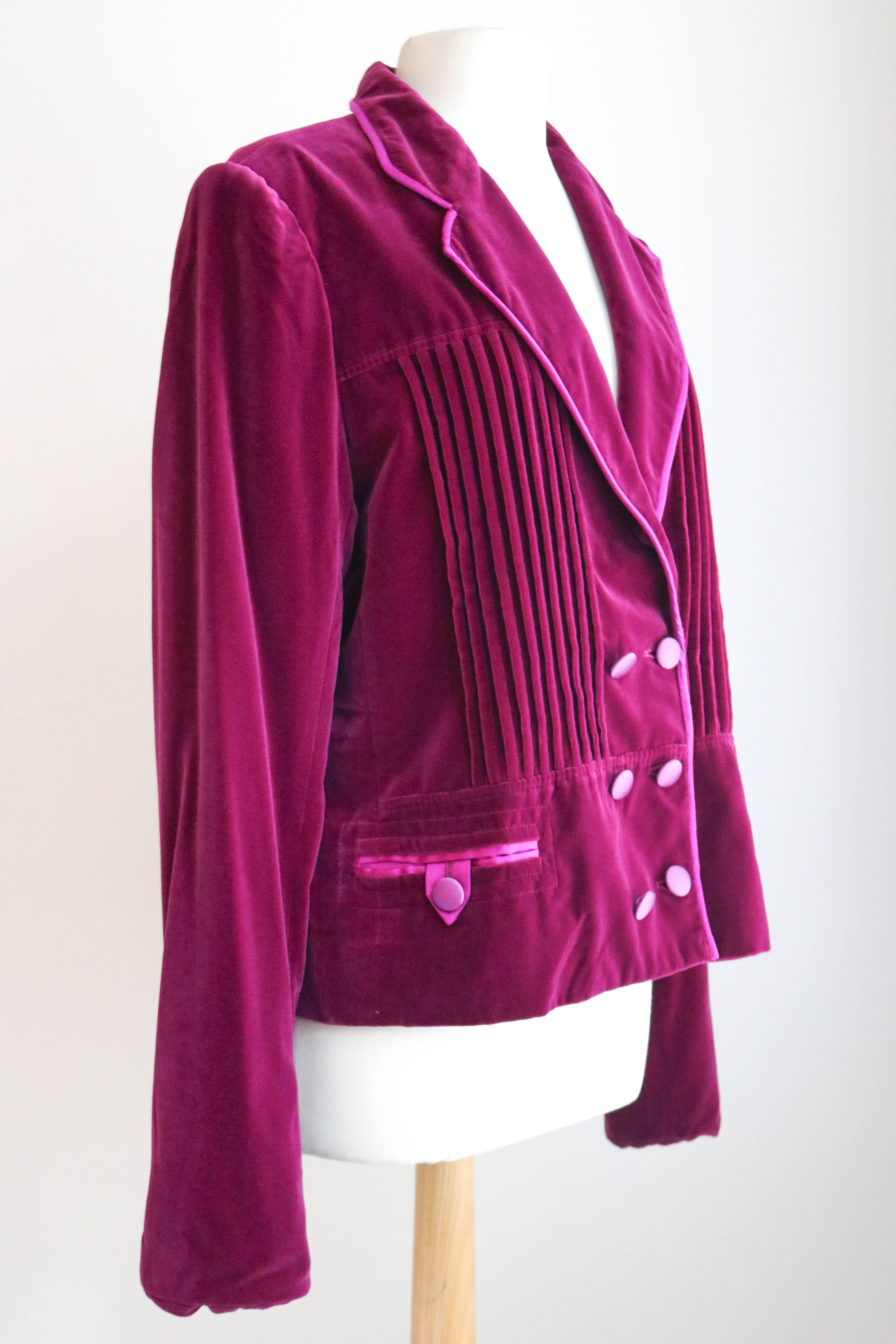 Offered is a stunning never worn YSL bright pink velvet evening jacket.  Piped in satin , with double breasted satin buttons.  Pleating details on front, with a notched collar.  Tabbed button pockets.  Retail price $2975.