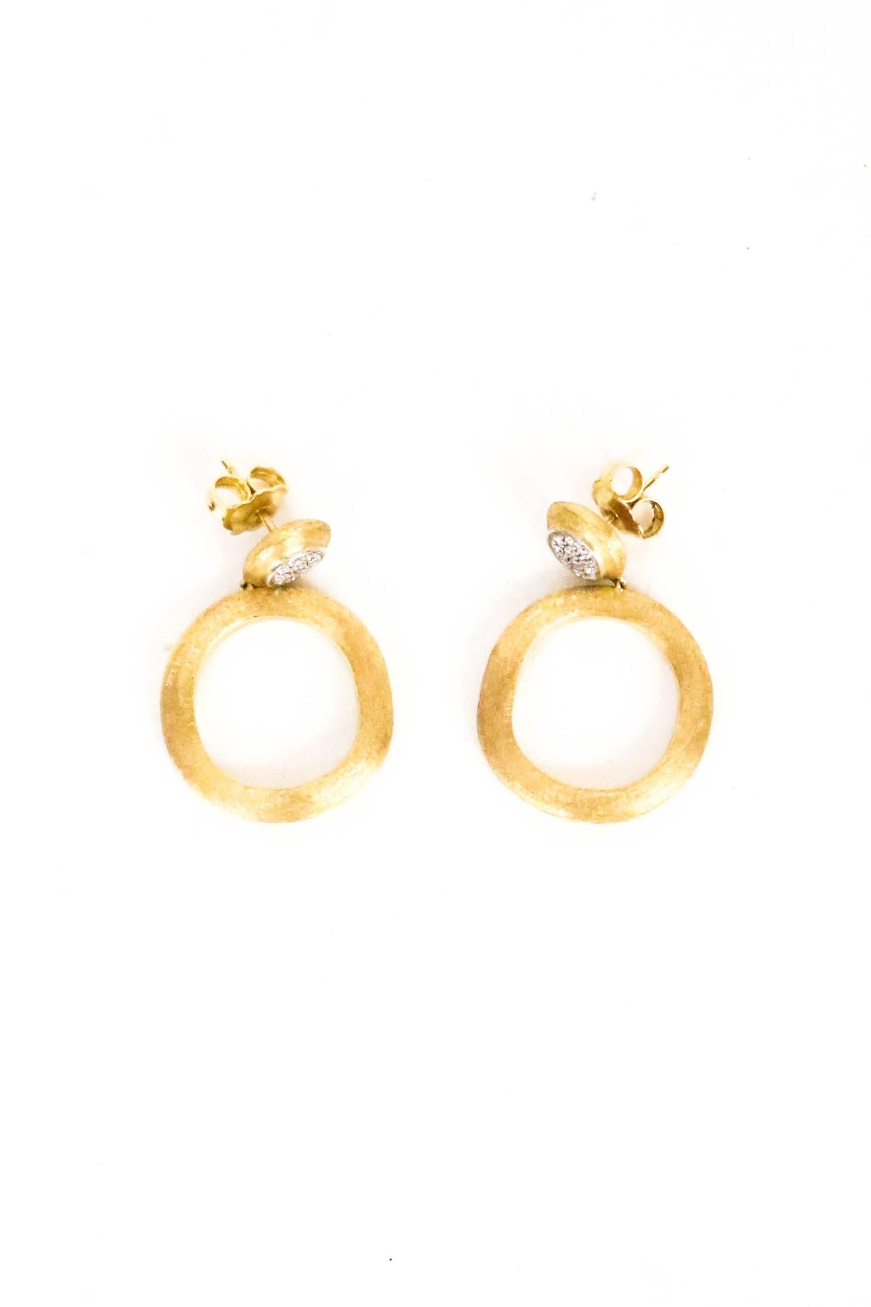 Offered is a stunning pair of Marcus Bicego earrings in 18k brushed yellow gold with pave diamonds.  Length of earring measures 1.25 inches.  Gold loops suspended from pave diamonds surrounded by gold.  On posts. 