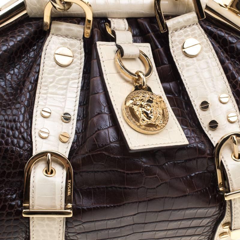 VERSACE Handbag Brown/Cream/Gold Croc Embossed Leather Madonna Boston Bag. Made in Italy. This chic Versace Madonna Boston Handbag enhances casual through to formal wear. Crafted from croc-embossed leather, decorated with the Iconic Versace motif