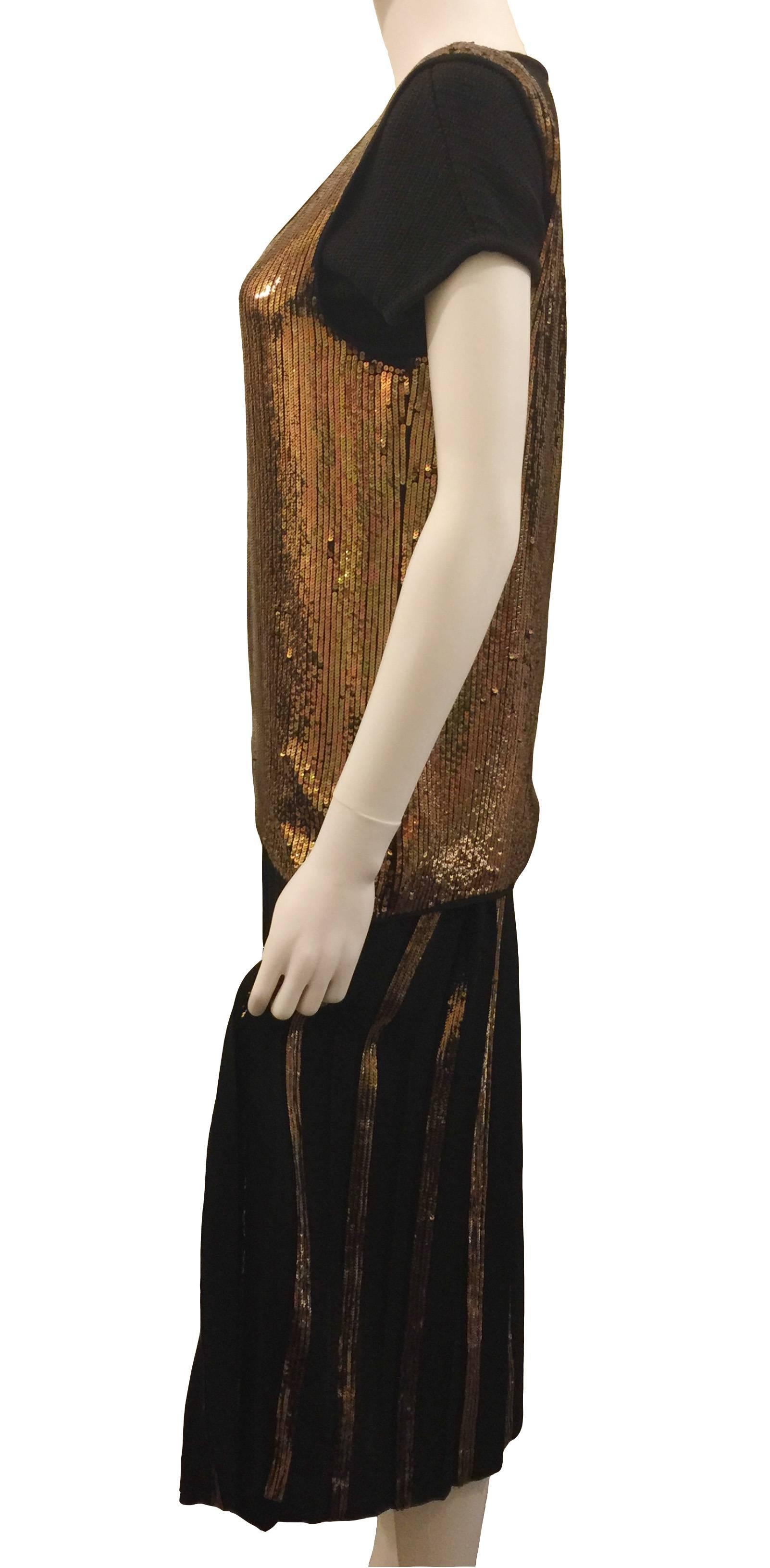 
VALENTINO Evening Ensemble.  Vintage 1985 Bronze Sequin Vest with Silk Crepe Sequin Pleated Skirt and Black Wool Knit T Shirt.  Size 10.  Shoulder Width 42cm; Overall Length 124cm; Bust 36 inches.  Silk Crepe & Sequin Vest with Black Knit Wool