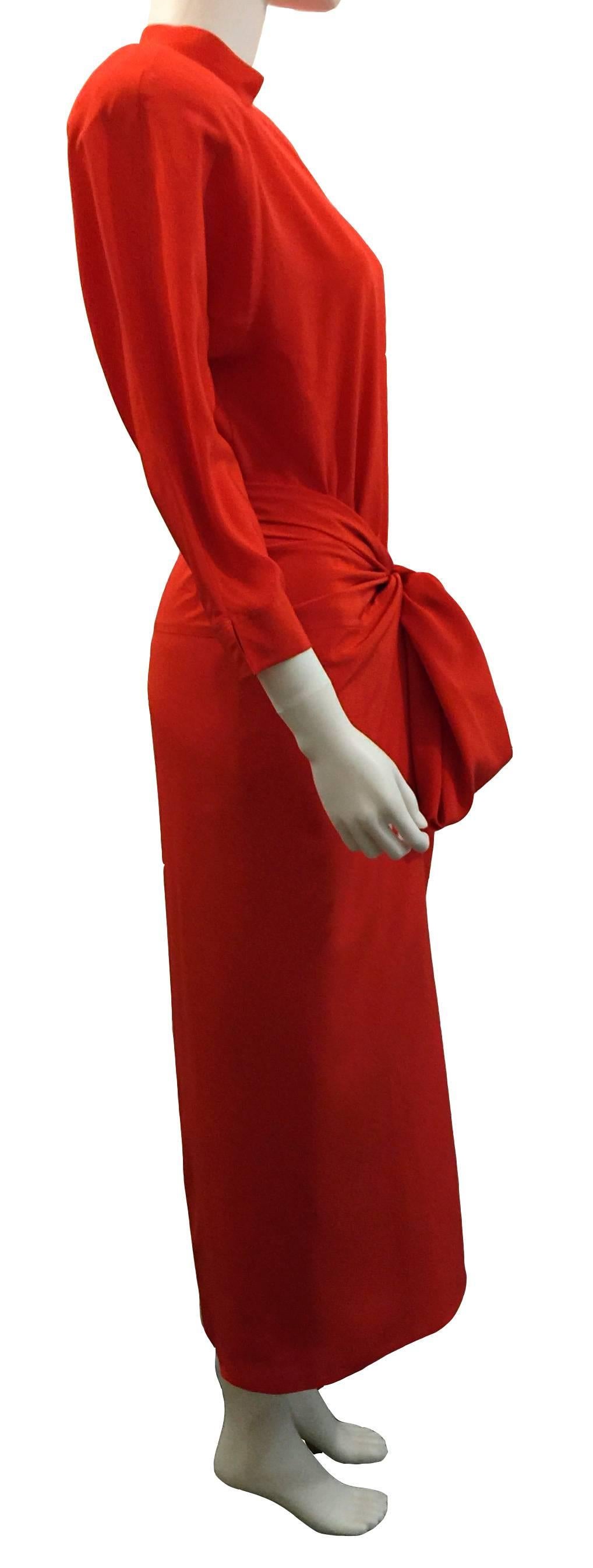 
Gianfranco Ferré Vintage Dress with Over-Skirt.  Beautiful two piece Red 100% Pure Silk Oriental feel to dress style.  Long column style with long sleeves to wrist.   Button detail with zip on back.  With Shoulder Pads (can be removed if