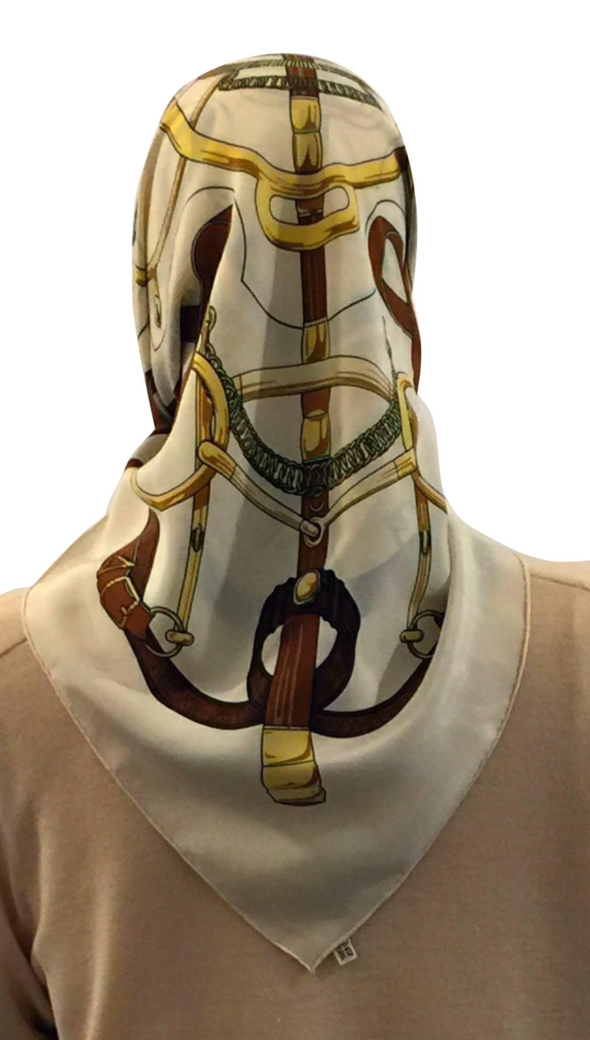 Hermes Crepe-de-Chene Silk Scarf .  Vintage Collector’s Item.  100% Silk.  Colors - Cream Base with Brown & Gold.  Size 91cm square.  This Elegant Scarf reflects the quality and refinement Hermes is renowned for.  Material 100% Silk.  Original Silk