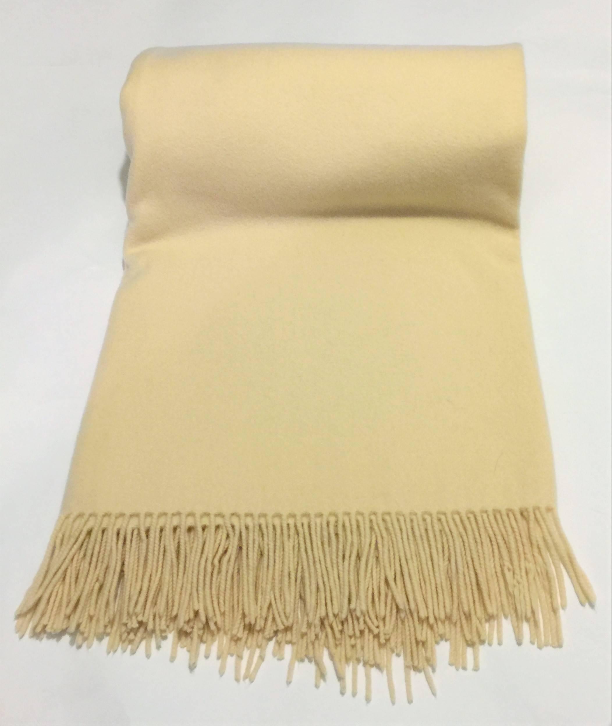 Hermes Paris Cream Cashmere Fringe Blanket.  100% Cashmere.  Vintage 1990’s.  Measurements are 59 by 79 inches (including fringe).  Colour Cream.  Traditional Classic Hermes Style.  Very Good Condition with only 5 of the 260 fringes showing signs of