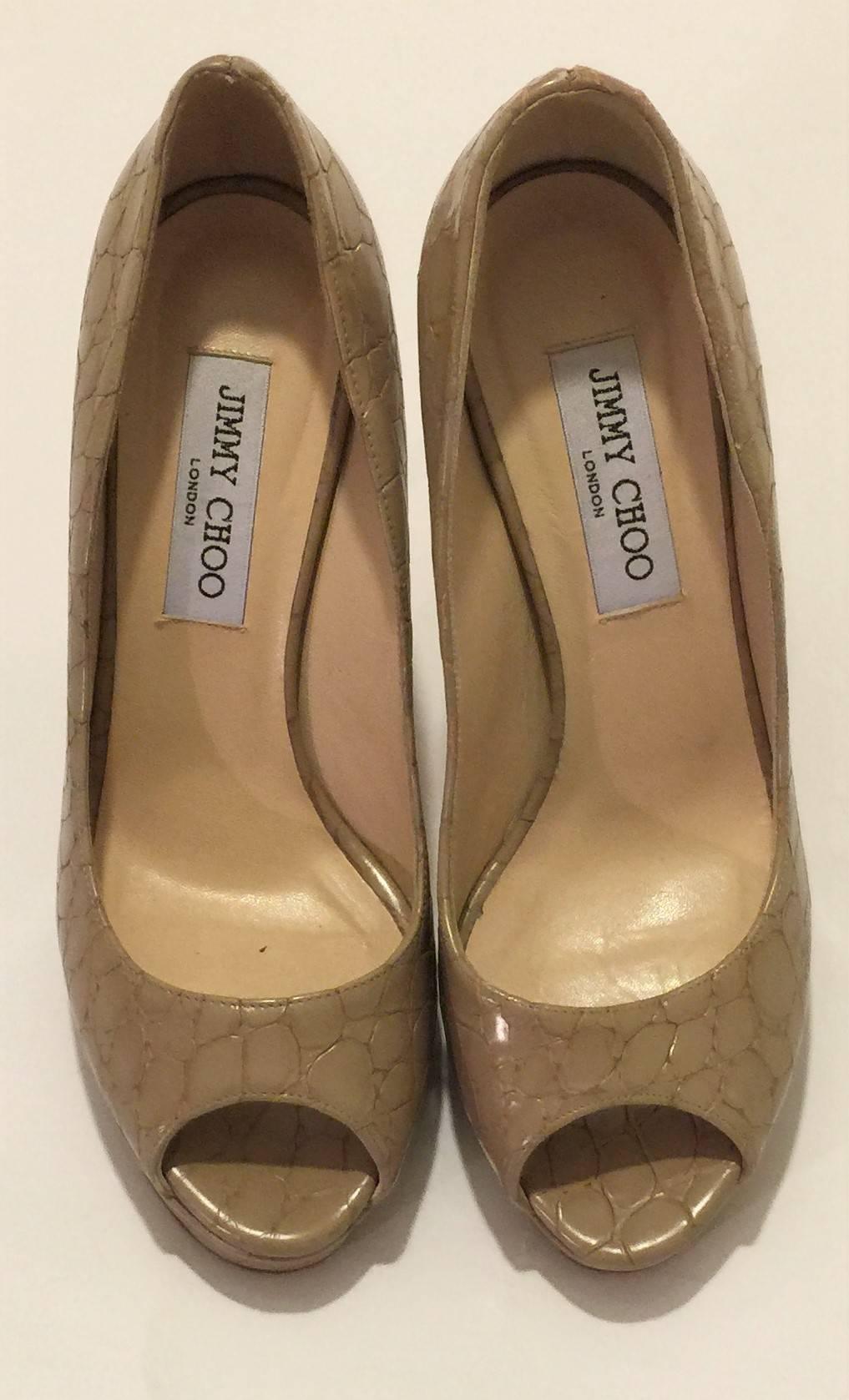 Jimmy Choo Crown Mock Croc Platform Peep Toe Pumps.  Ultra Chic mock croc leather platform peep toes MUST HAVES.  Colour beige.  Made in ITALY.  Size is EU38.  Heel height is 13cm.  Platform is 2.5cm.  Good Pre-Owned, condition gently used, scuffs