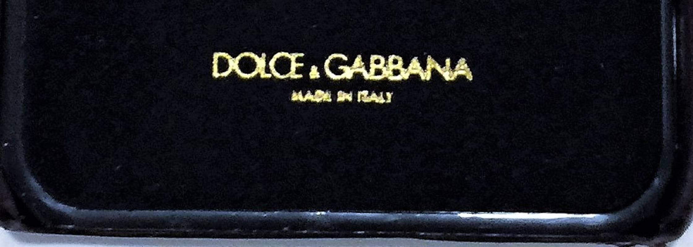 Dolce & Gabbana Crystal Embellished iPhone 6 Case.  Current model. Bordeaux calf leather, crystal embellished, featuring a lizard skin effect, rhinestone crystal floral embellishment.  Made in Italy.  Suitable for iPhone 6 – not 6 Plus. Iguana