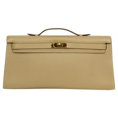 Hermès Swift Kelly Longue Clutch Pochette Parchemin  Gold HW & Classic Lock
