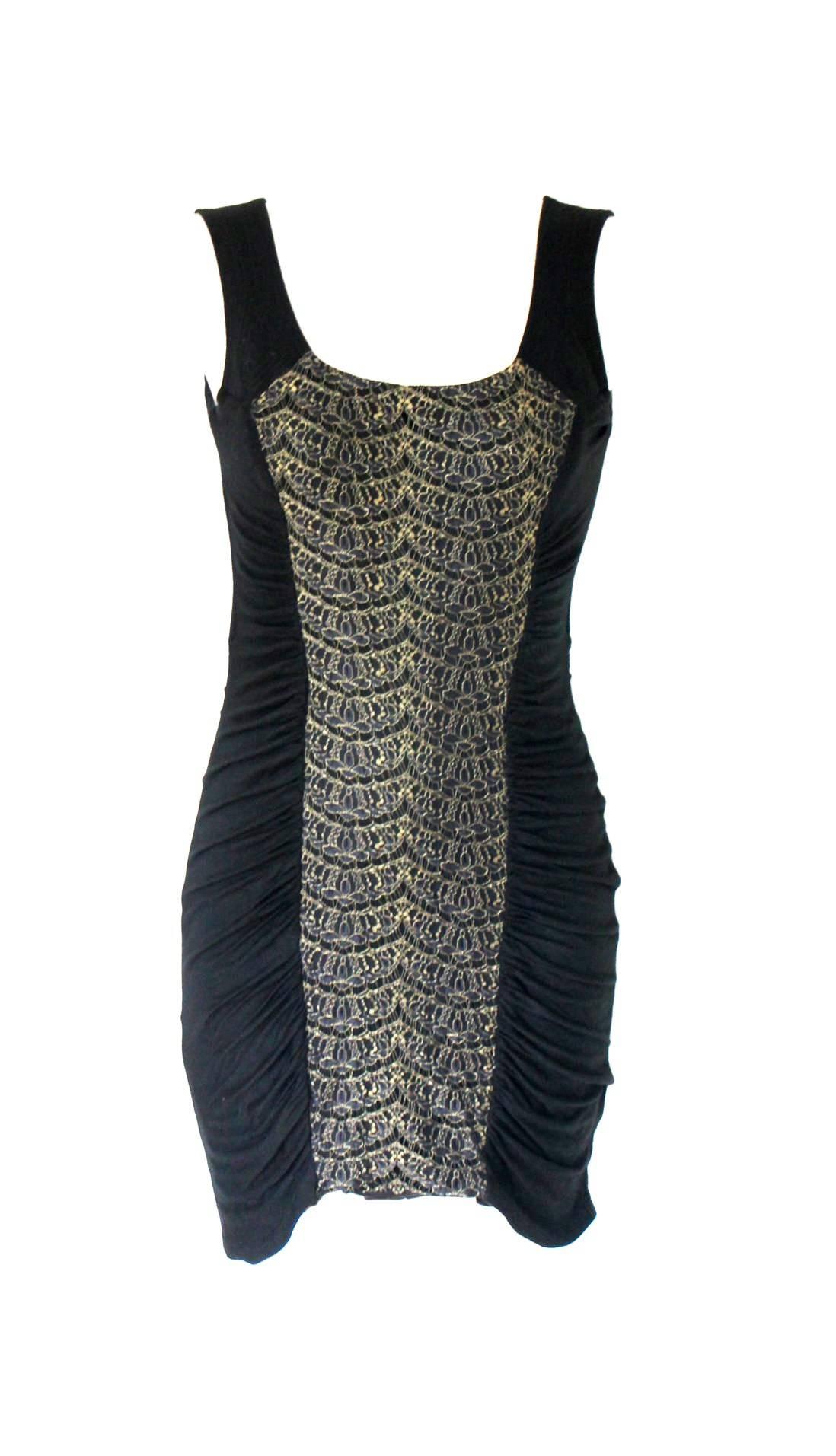 
RARE BLACK BODYCON CUTOUT DRESS WITH GOLDEN LACE

BY GIANNI VERSACE COUTURE

FROM HIS FAMOUS 1990S COLLECTIONS

OWN A PIECE OF FASHION HISTORY - A TRUE GEM
SO HARD TO FIND IN EXCELLENT CONDITION

    Impossible to find!
    From VERSACE 1990s