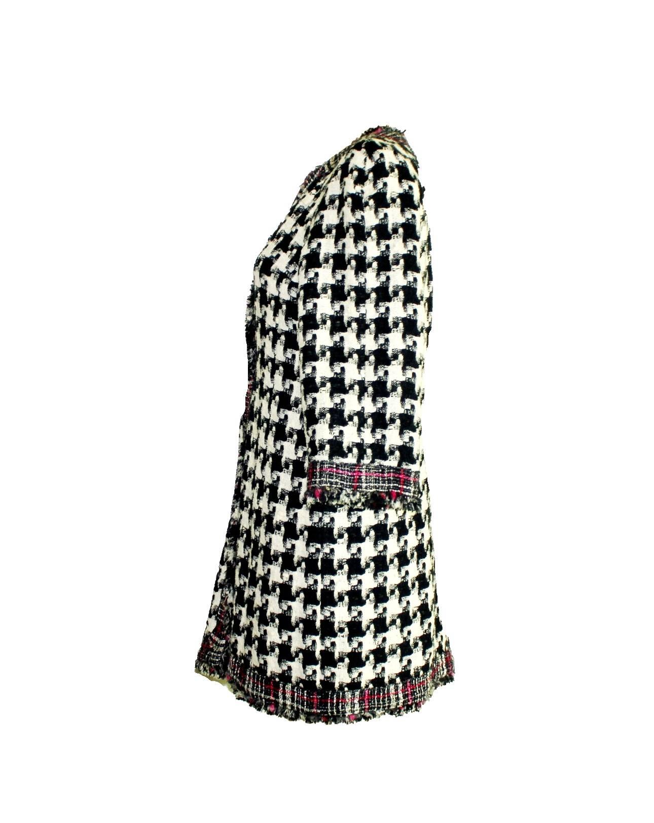 AMAZING & RARE

CHANEL

REVERSIBLE MULTI-COLOR & HOUNDSTOOTH TWEED COAT

DESIGNED BY KARL LAGERFELD

A TRUE CHANEL PIECE THAT SHOULD BE IN EVERY WOMAN'S WARDROBE

DETAILS:
Beautiful CHANEL tweed coat designed by Karl Lagerfeld
A true