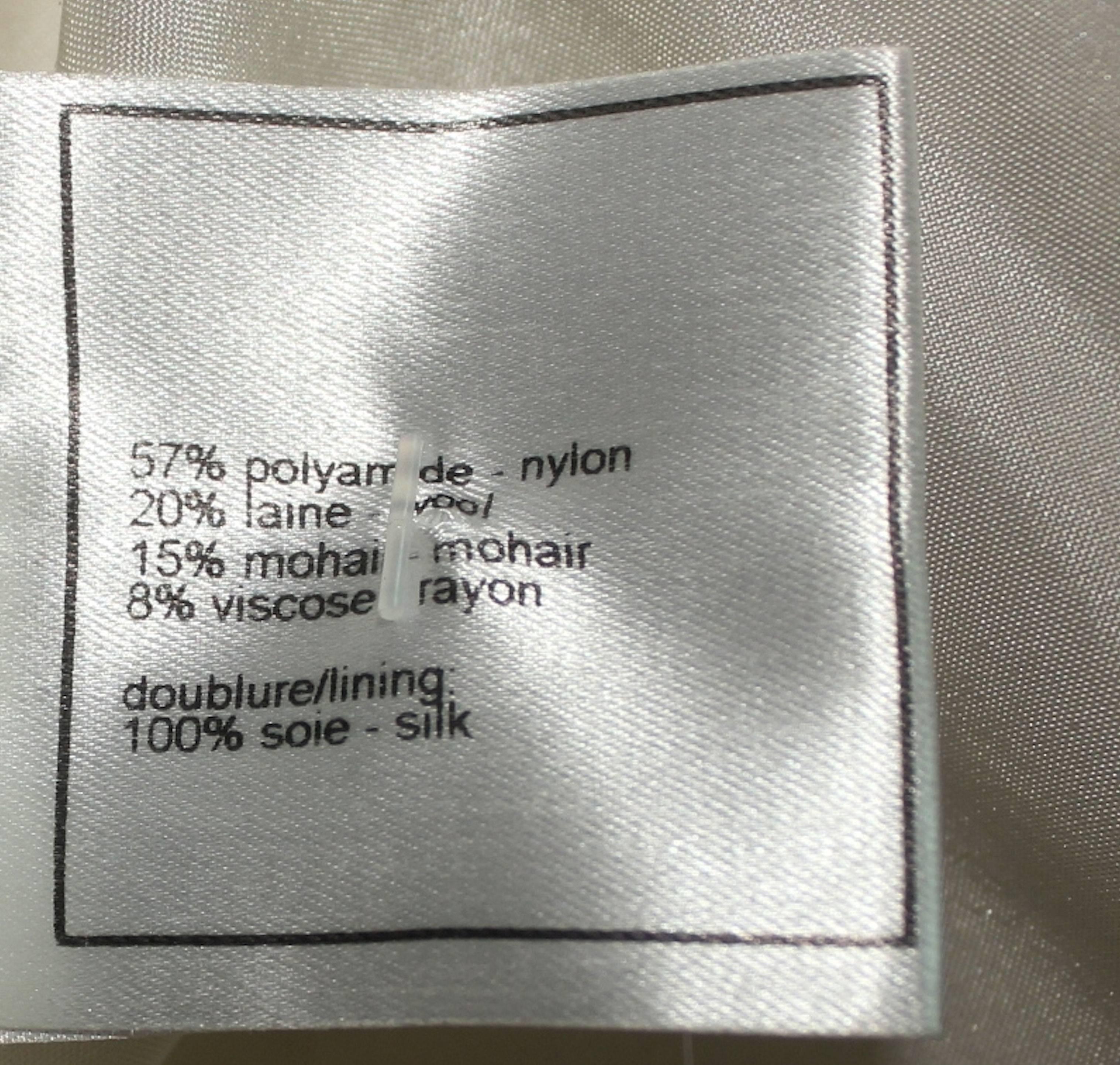 Raro cappotto CHANEL da collezione in tweed bianco e nero con cintura 1