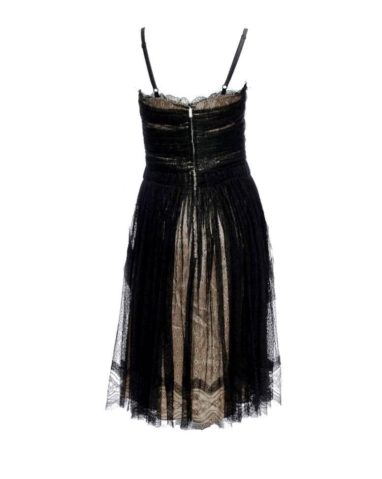     A DOLCE & GABBANA classic signature piece that will last you for years
    Made out of a fantastic material combination mix
    Black lace with corset top
    Skirt made out of finest black lace with patent leather details
    Zipper
