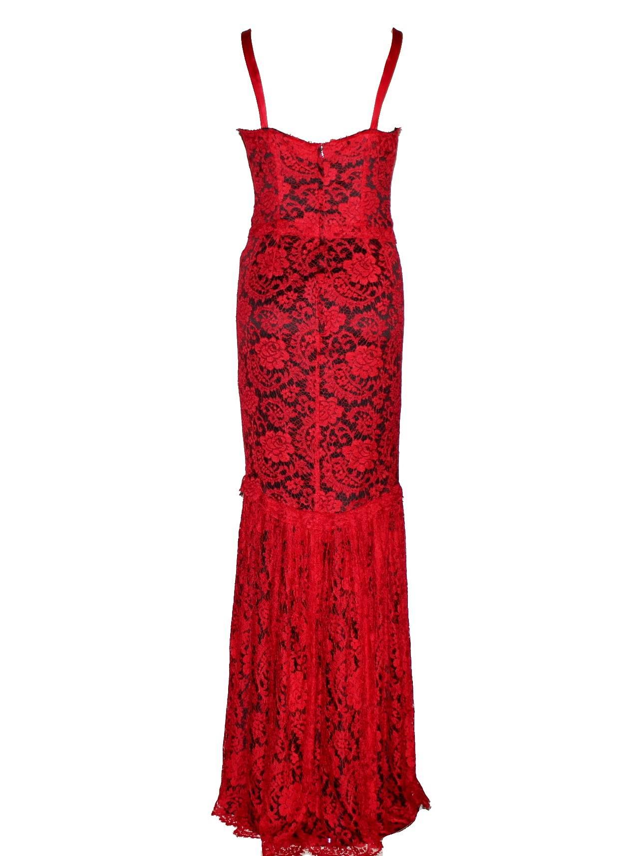 GORGEOUS DOLCE & GABBANA RED LACE EVENING GOWN

    A DOLCE & GABBANA piece that will last you for years
    Made out of lustrous black silk with beautiful red lace ontop
    Boned bodice
    Dropped waist
    Gathered skirt
    Hook