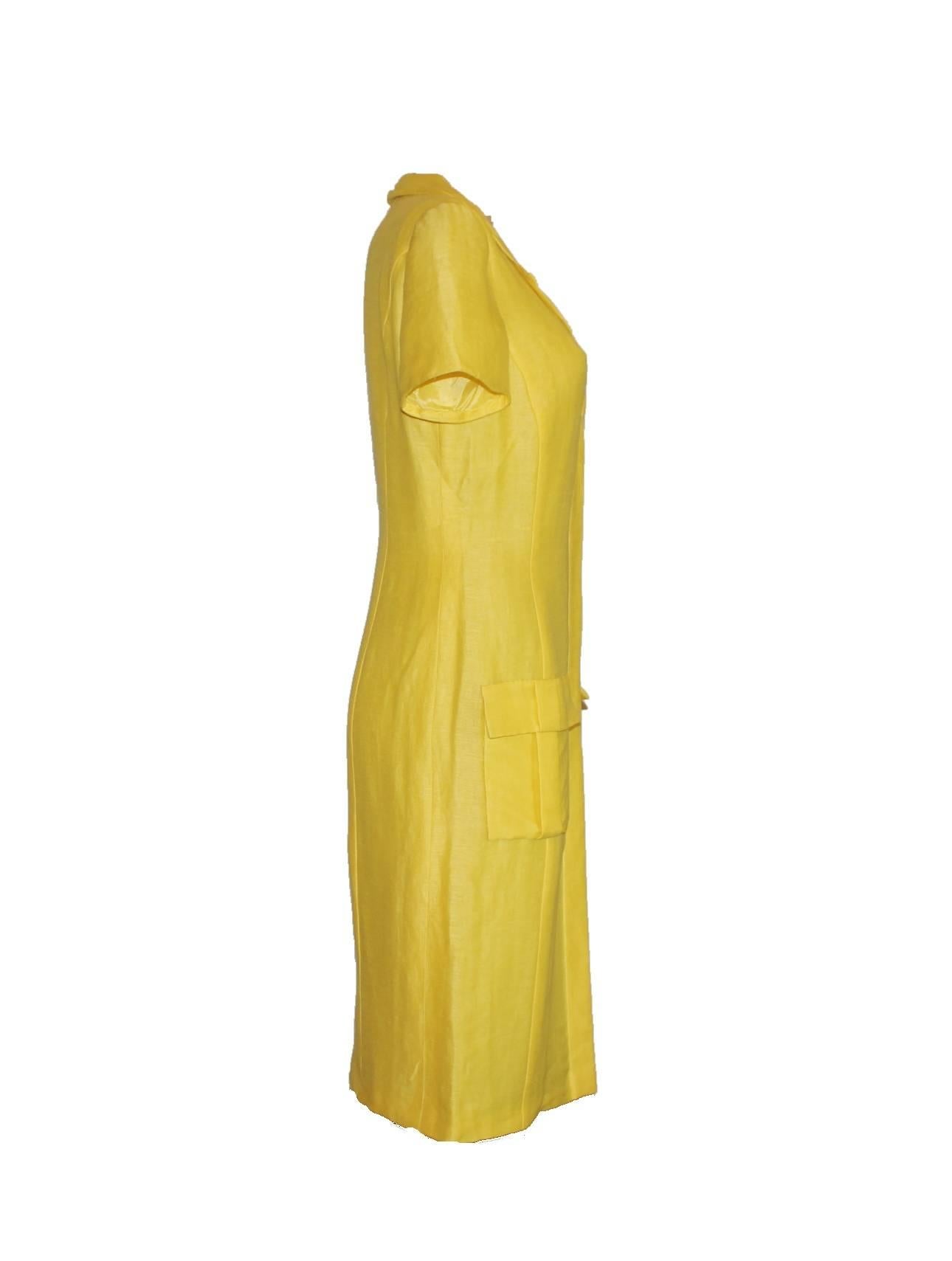 Canary-yellow silk and linen mix summer dress by Gianni Versace Couture
Closes in front with hidden buttons
Shown on runway show and in the AD campaign with Gisele
Fully lined
Two front pockets
Size 40
Made in Italy
Dry Clean Only