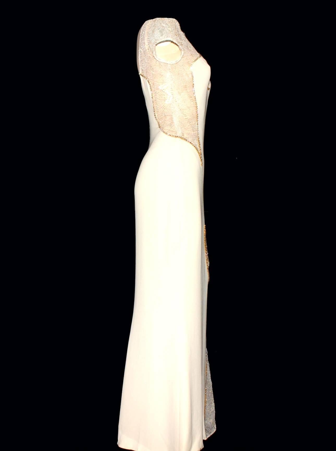 Unique Gianni Versace Couture Evening Gown
Stunning piece 
From the SS 1998 collection
A one-of piece - special order in ivory
Spider-web lace cut out details
Swarovski crystal trimming
Asymmetric design
A similar dress from the same collection is