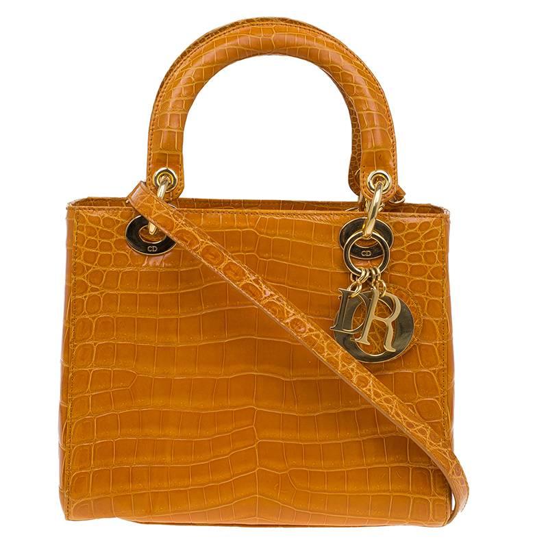Absolutely rare Christian Dior Lady Bag
Finest Caramel Colored Alligator Skin
In excellent condition
Detachable shoulder strap
Golden hardware
Fully lined with nappa leather
Comes complete with Dior Box, Dior Authenticity Card and Dior Dustbag
