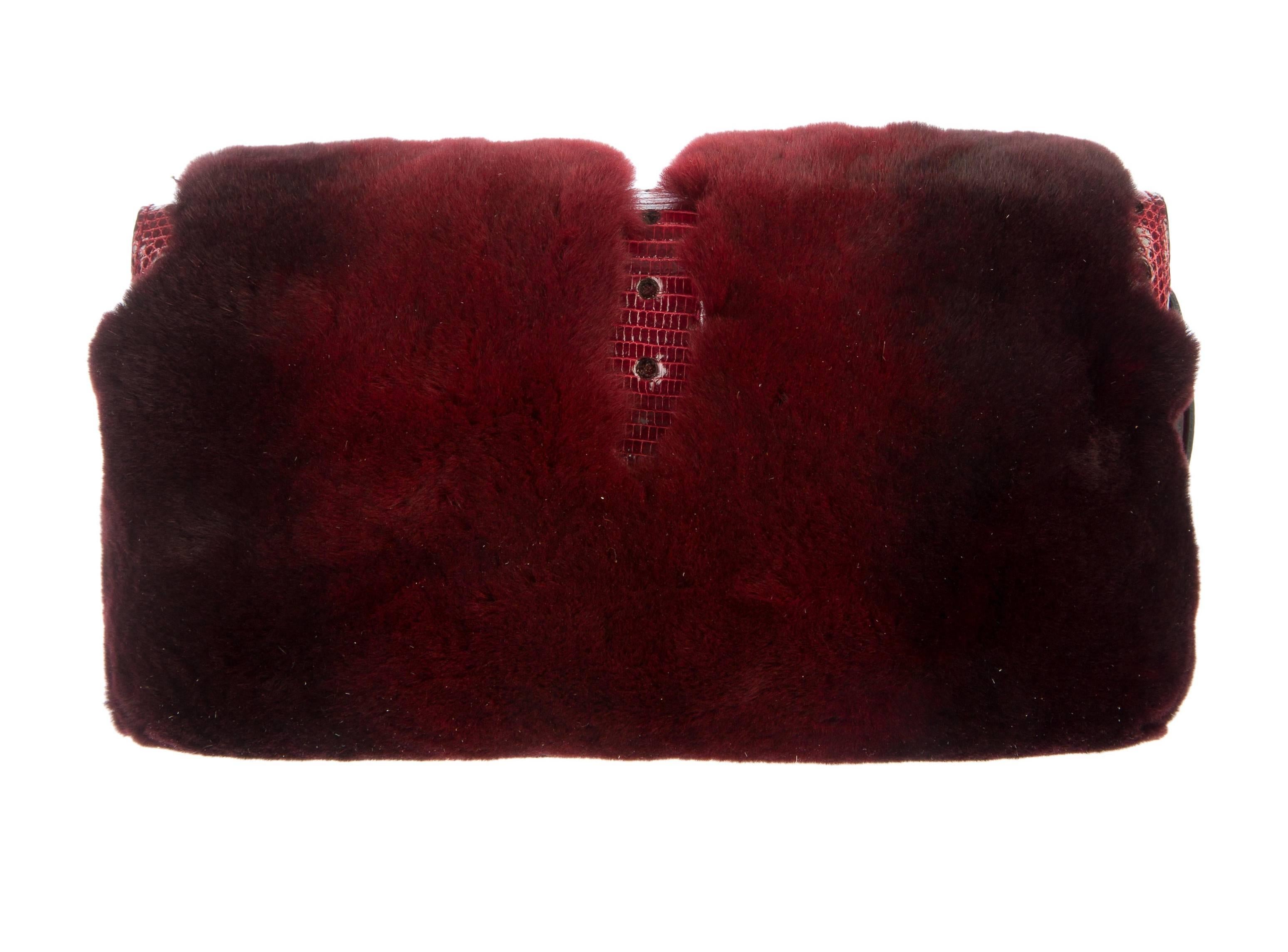 
A GUCCI signature piece that will last you for many years
Very rare Collector's item
Only very few pieces were made and sold in selected boutiques
Made of beautiful burgundy fur (probably shorn mink?)
Huge handcrafted jeweled clasp discreetly