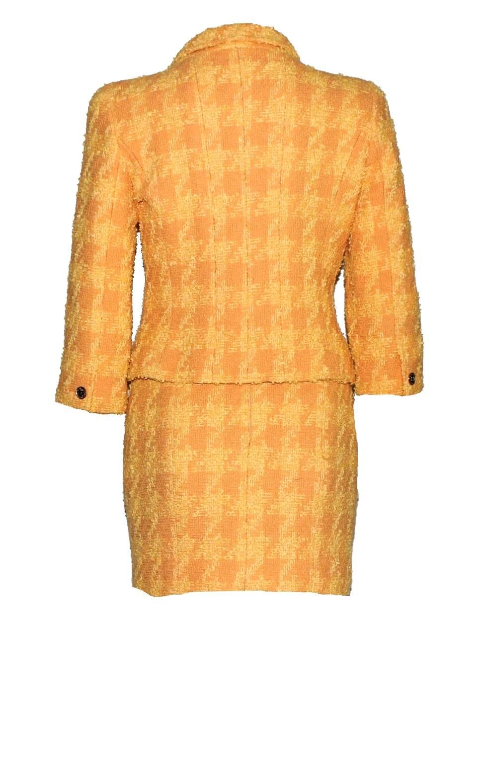 Beautiful CHANEL tweed boucle jacket with matching skirt designed by Karl Lagerfeld
A true CHANEL signature item that will last you for many years
Both pieces can be worn as a suit or single - always stunning!
Perfect to be worn casual with jeans or