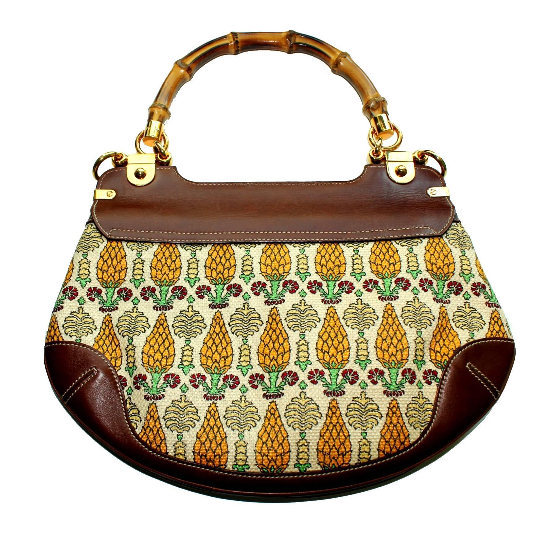 A signature bag by Gucci in the famous "Pigna" print with pineapple cones
Trimmed with finest brown leather
Gold-colored hardware and decorative studs
Bamboo handle and closure
Fully lined with fabric
Detachable shoulder strap