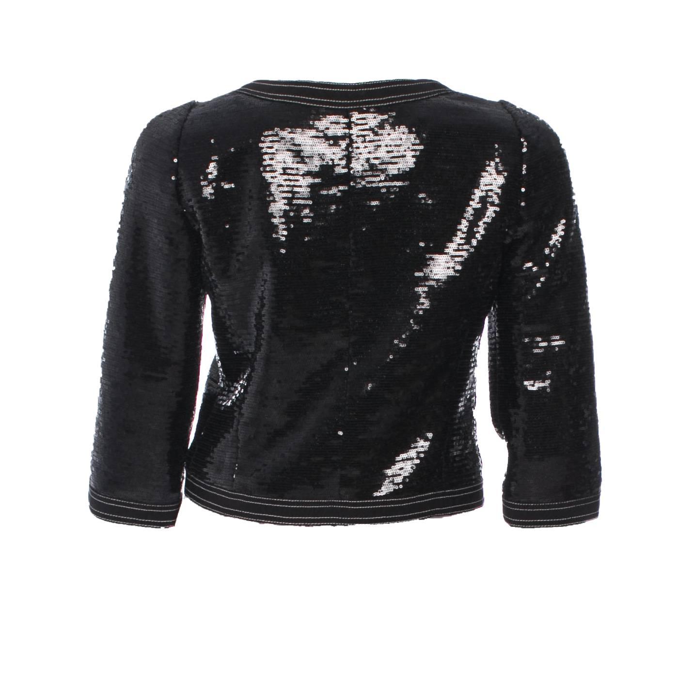 Stunning Black Chanel Sequin Jacket
One of Chanel's absolute signature pieces
The famous Little Black Jacket
Cropped Sleeves
Fully lined with silk
Sold out immediately
Recent collection
Brandnew