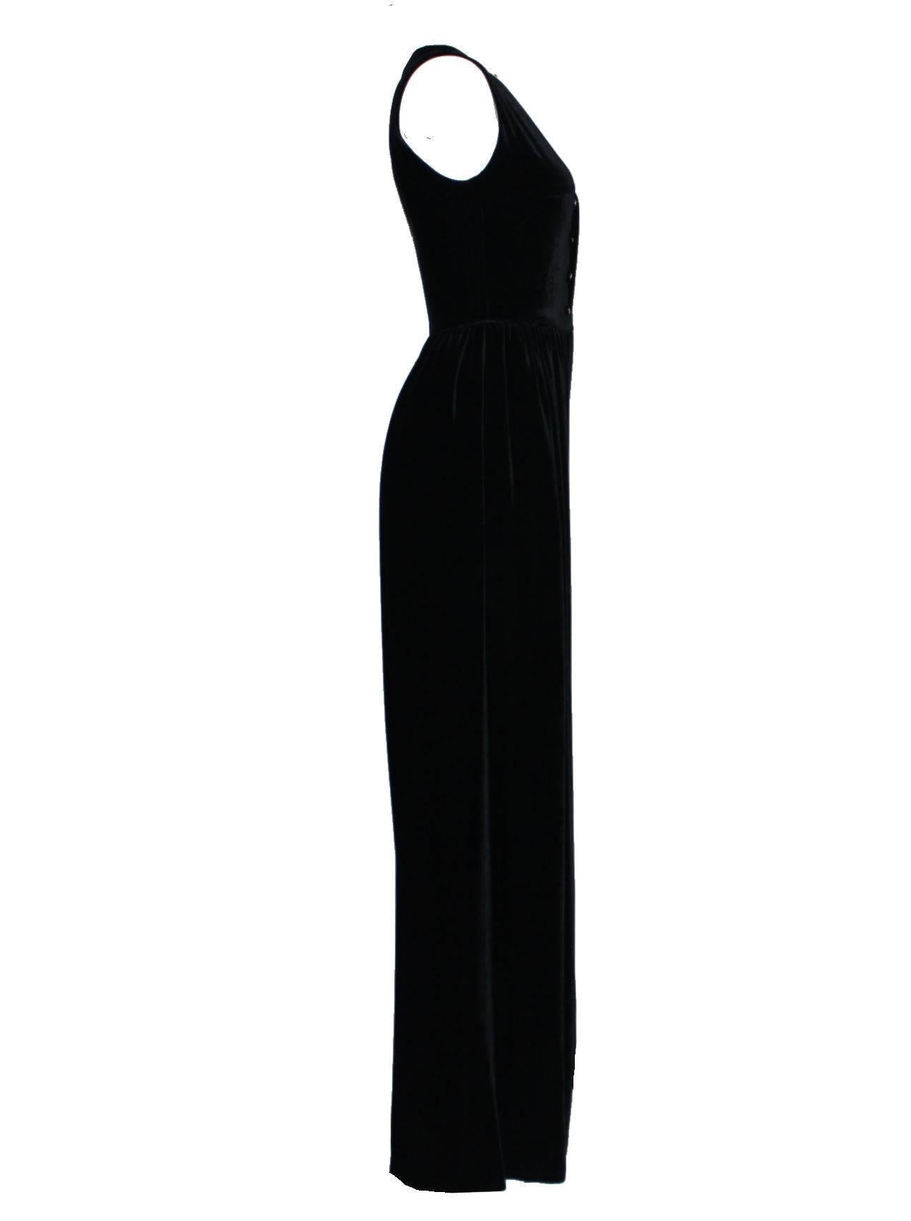 Amazing piece by Chanel
Softest black velvet fabric
Tight fitting upper part with wide palazzo style pant legs
Looks almost like a evening gown
Opens in front with the famous CC logo buttons
Perfect piece, very versatile
The costume jewelry is not