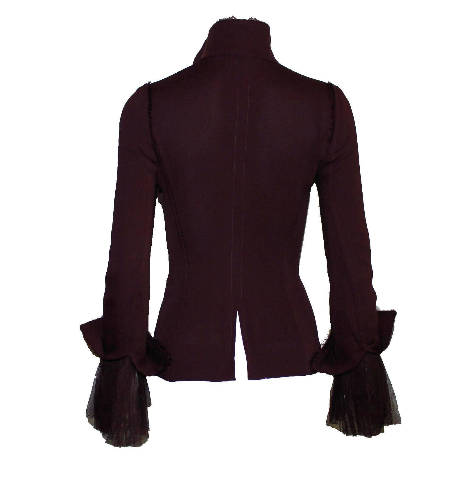 Stunning piece designed by Tom Ford for his FW collection for Yves Saint Laurent in 2002
Finest aubergine silk and tulle silk
Frayed details
Collection Autumn/Winter 2002
Two way front zippers engraved with YSL
Slit in back for a perfect fit
Made in