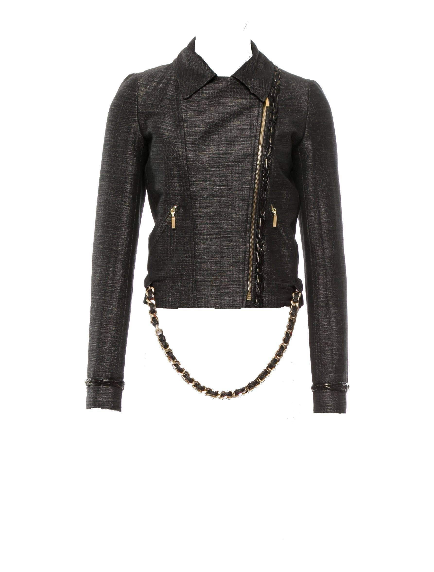 Fantastic Chanel Jacket designed by Karl Lagerfeld
Biker design
Fully lined with golden fabric
Closes in front with asymmetric zip
CC logo on buttons and zippers
Chain trimming
Heavy CC signature chain belt
Belt can be removed and worn with other