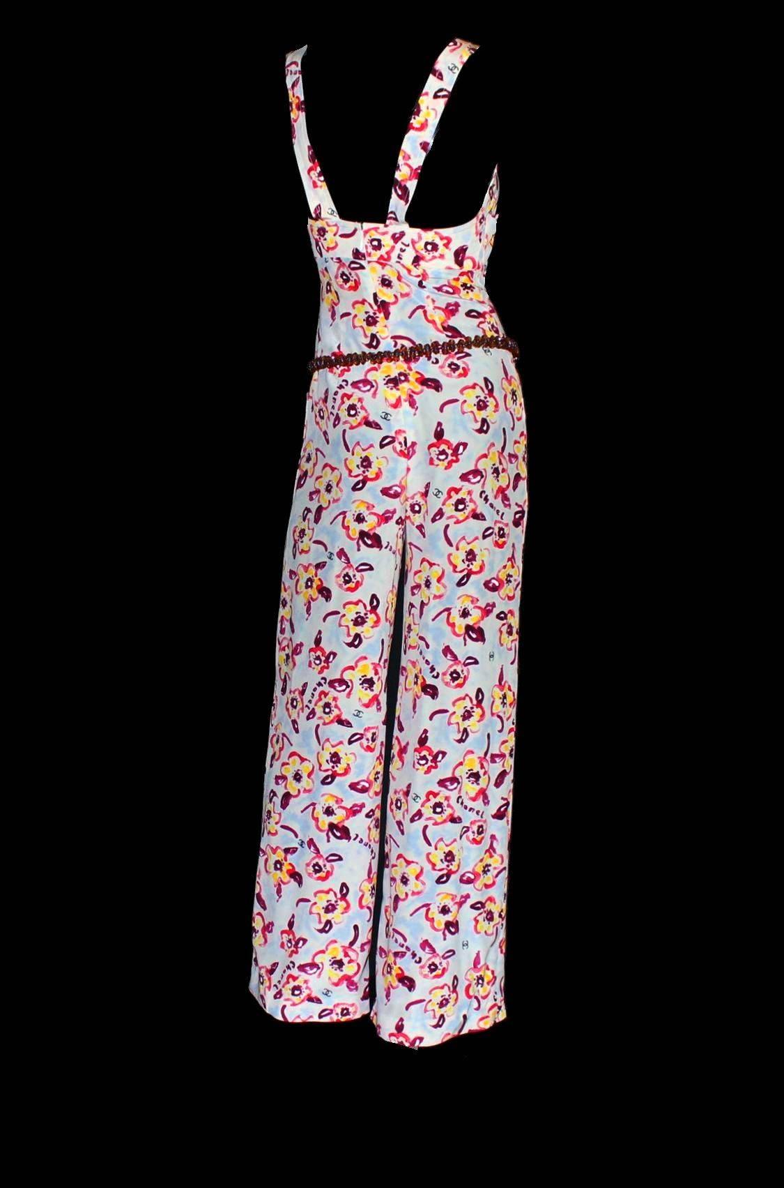 
       Stunning Chanel Jumpsuit 
        Unique vintage piece
        Two straps attched with Chanel buttons
        Hidden zip on back
        Wide palazzo style legs
        Four front pockets
        Chanel logo print with 