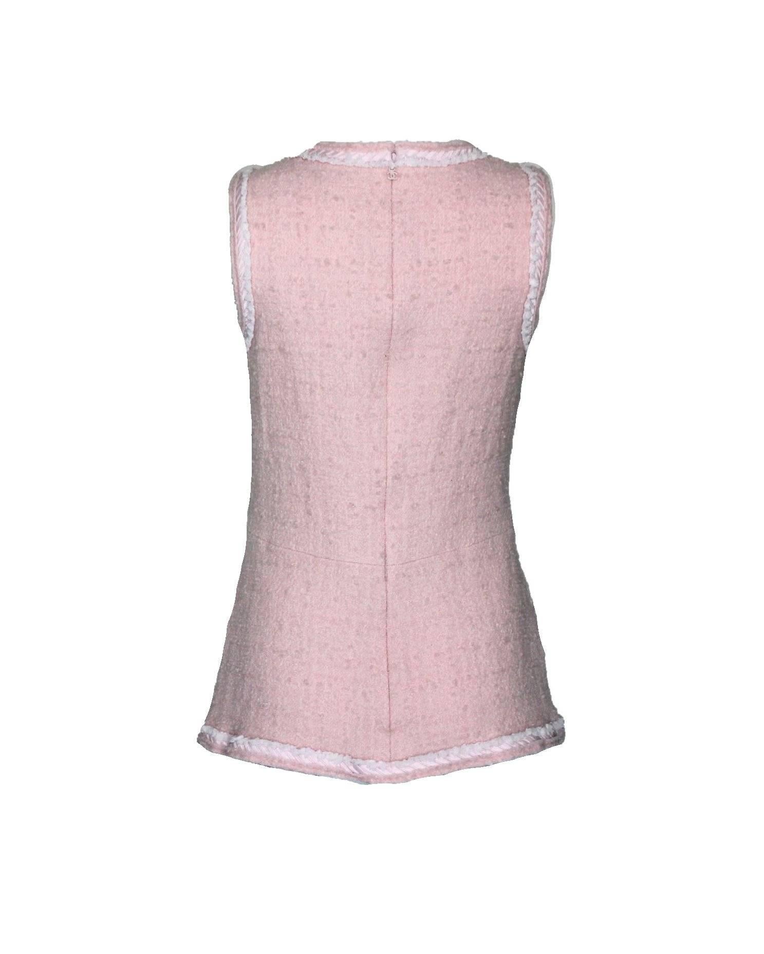 Chanel signature fantasy tweed top
The tweed fabric is exclusively produced by Maison Lesage
Designed by Karl Lagerfeld 
Beautiful trimming with fringe details
Pale pink color
Two front pockets
Fully lined with CC logo silk
Opens with long zip in
