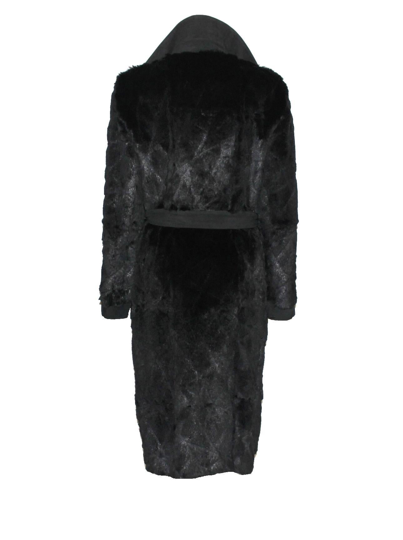 

    A great piece  by GIANNI VERSACE COUTURE
Worn by Gisele on the runway
    This gorgeous coat is made out of finest jet black fur (composition tag is missing, probably trimmed mink?) with asymmetric laser cut details
    Suede leather