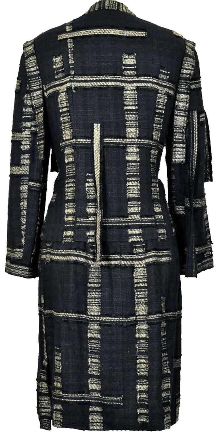 Amazing CHANEL Skirt Suit with golden thread fringed trimming,

A true CHANEL classic. The same jacket was worn by top stylist Rachel Zoe. 
The jacket closes with hidden buttons engraved with "CHANEL Paris". 

Jacket is fully lined with