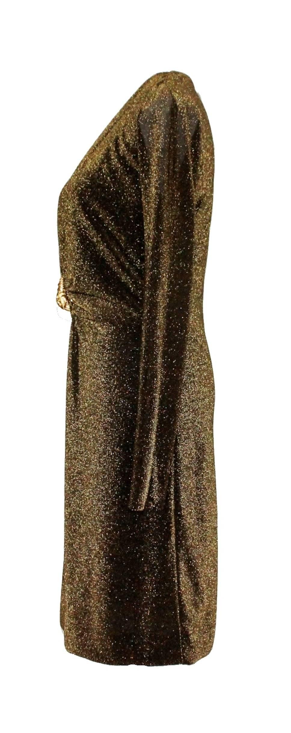Stunning Dress by Tom Ford for Gucci
From his collection for Gucci in Fall/Winter 2000
Long sleeves
Deep Plunging Neckline
Gold-colored metal hardware lion brooch in front
Made in Italy
Dry Clean Only
Size 42
Brandnew with original tags still