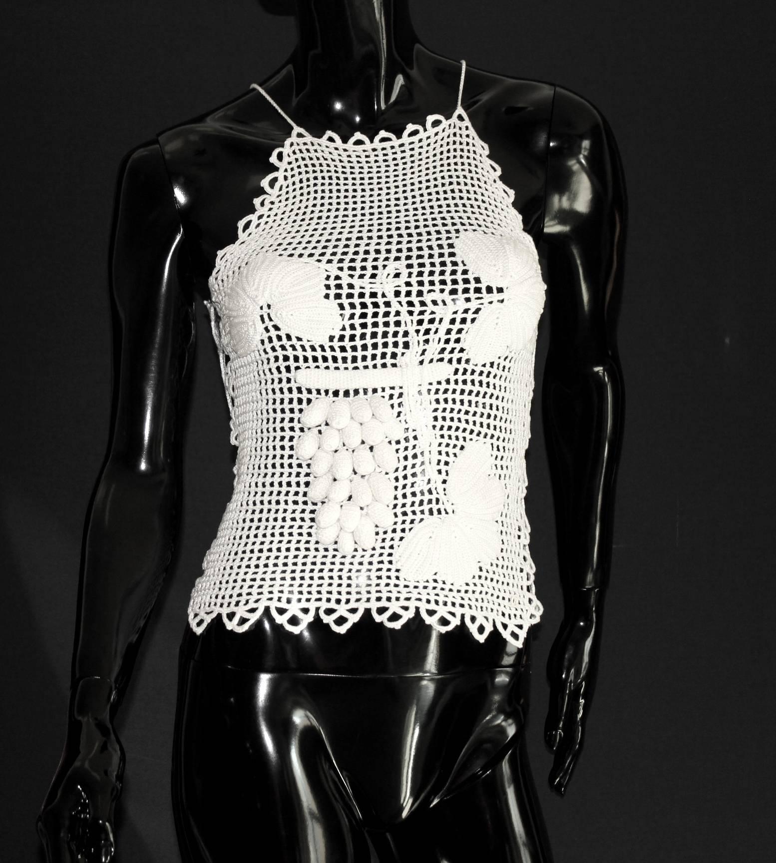 White Chanel 3D Crochet Couture Knit Top

    A couture-like piece by CHANEL
    Fine Crochet Knit with 3D application
    Sexy cut outs on side
    Extremely rare to find
    Prisine condition
    Made in France
