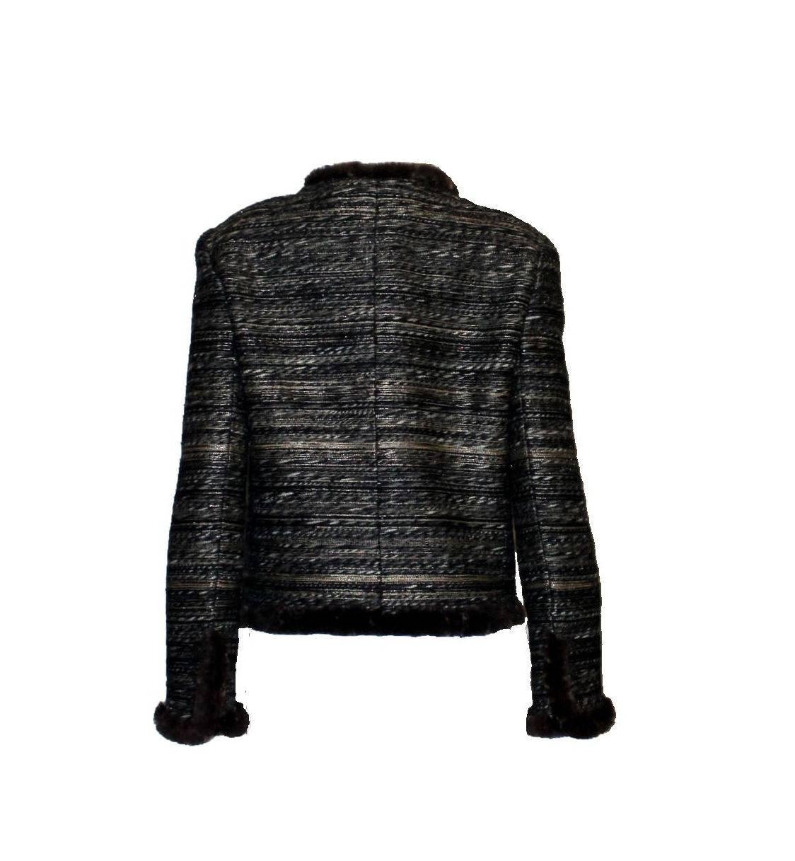 Beautiful CHANEL fantasy tweed jacket 
A true CHANEL signature item that will last you for many years
Closes in front with concealed hooks
Amazing metallic tweed fabric
Beautiful CC Chanel signature buttons on sleeves with real button holes 
Trimmed
