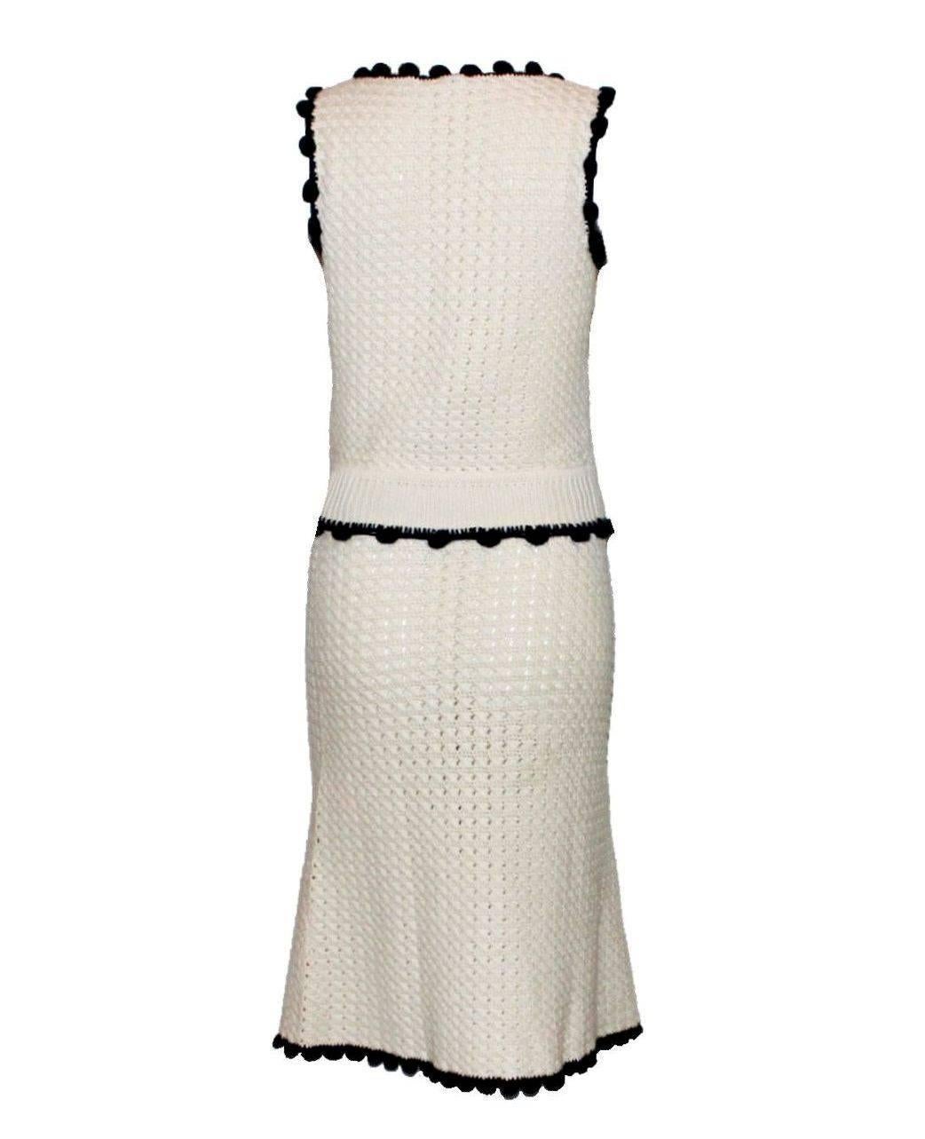 A stunning Chanel Ensemble
Consisting of a top and matching skirt
Can be worn together as a complete outfit or separate
Beautiful crochet knit 
A true Chanel signature piece in the famous signature design
Soft ivory knit with dark contrast
