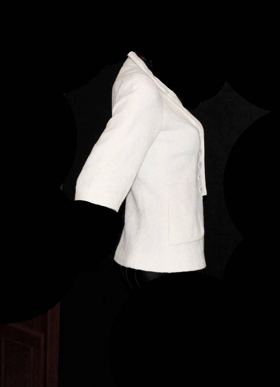 Chanel Signature jacket
A timeless classic that should be in every woman's wardrobe
Designed by Karl Lagerfeld
Finest ivory tweed exclusively produced by Maison Lesage for Chanel
Cropped sleeves
Two front pockets
Closes with tweed buttons with the