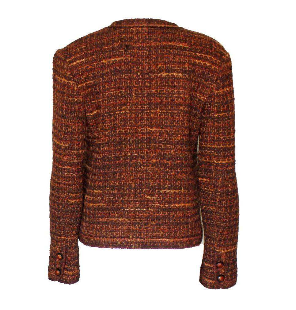 A stunning Chanel Tweed Jacket
Beautiful tweed fabric
Perfect for the colder season in winter colors
Crochet knit trimming
Two front pockets
Fitted style
Amber-style buttons with camellia inside
Fully lined with brown fabric
Chain at hem for a