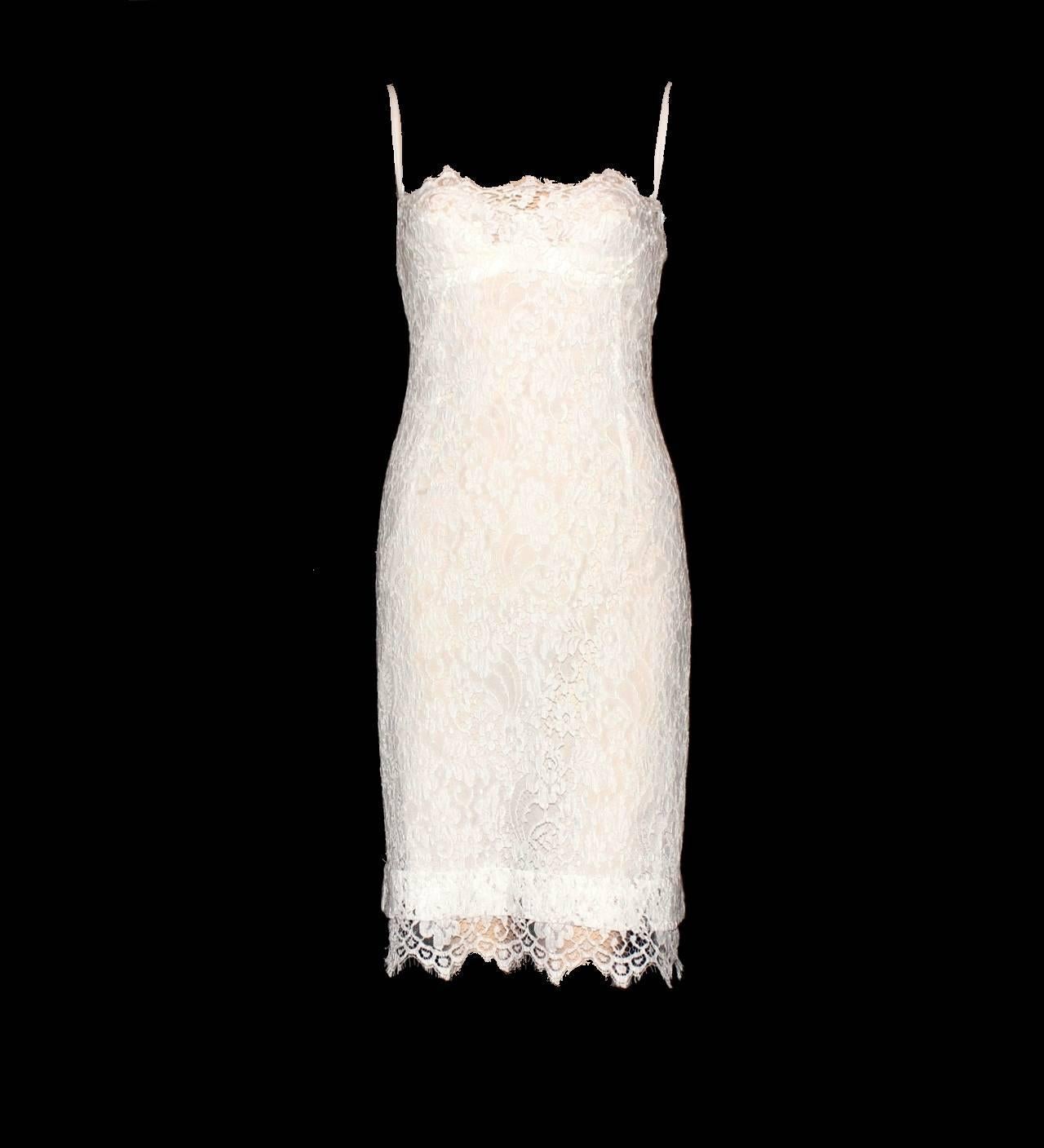     A DOLCE & GABBANA classic signature piece that will last you for years
    Dress made out of finest lace
    Scalloped edges
    Zipper in the back
    Comes with attached bra-slip dress
    Neckholder details
    Dry clean only
    Made in