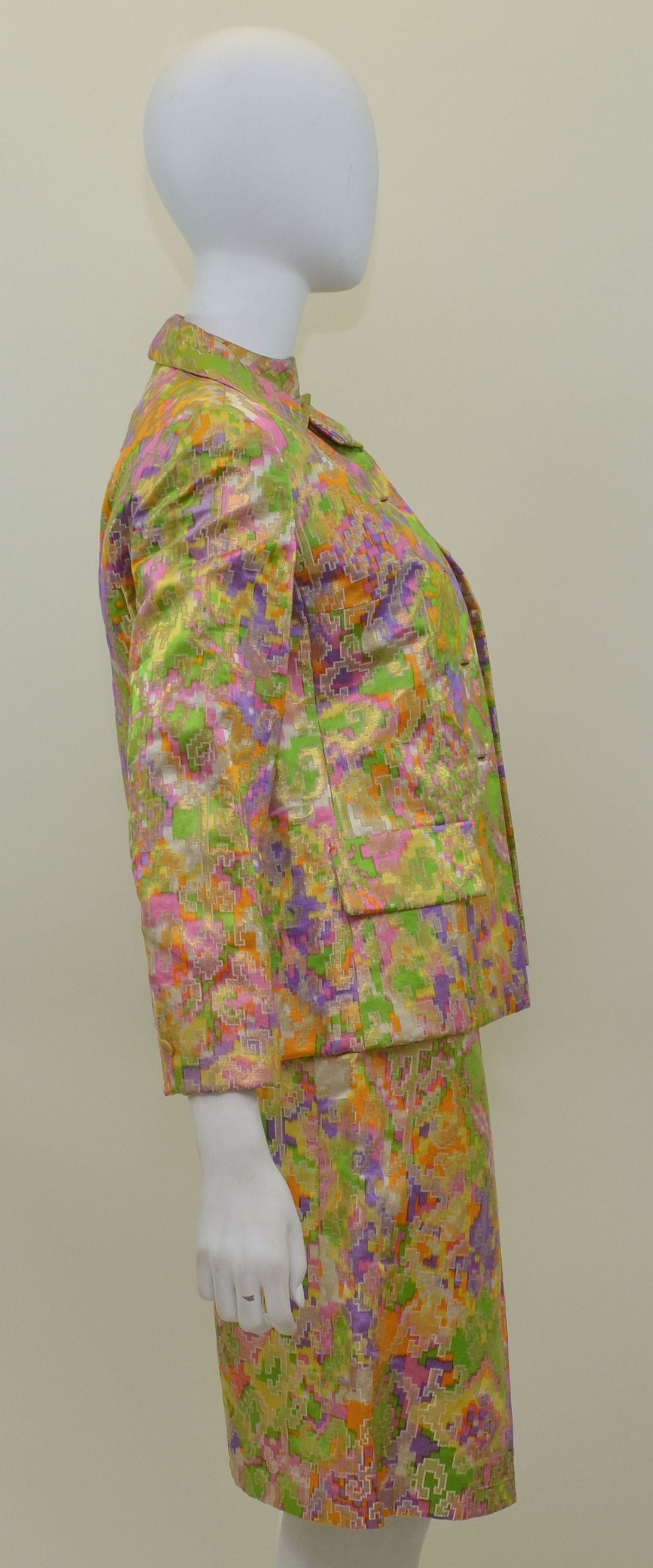 Vintage1960's Christian Dior silk Brocade 3 Piece Suit Set. Color, pattern and quality of fabric is of extraordinary quality. Jacket features gold button closures along the front as well as the cuffs, faux flap pockets at the front, and fully lined