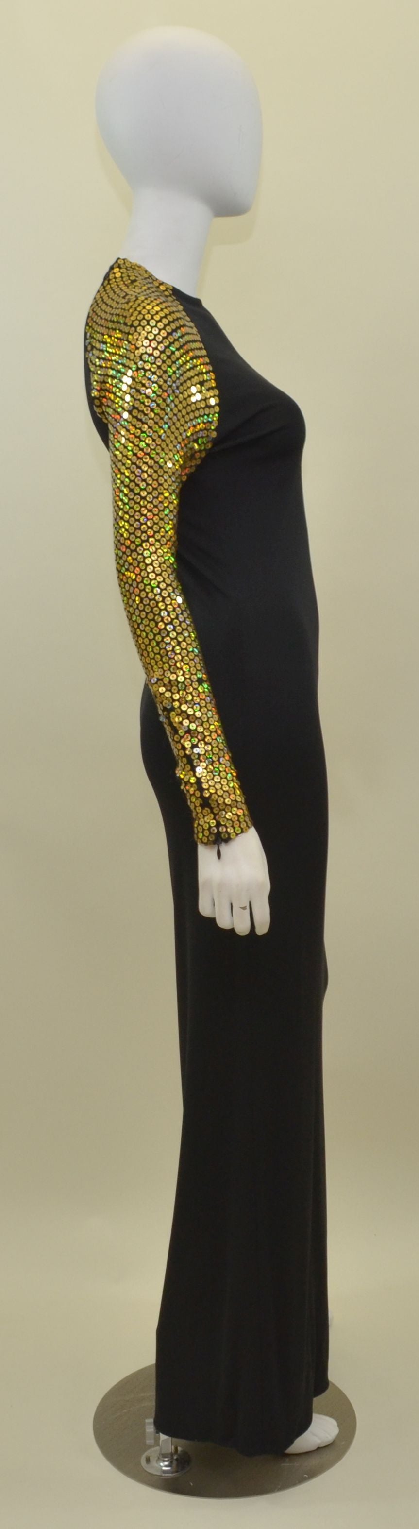 Vintage Halston dress features gold sequin detailing along the sleeves, zipper openings at the shoulders as well as the cuffs. Dress is in great condition with few missing sequins. No major flaws to be mentioned.

Measurements: 
Bust -