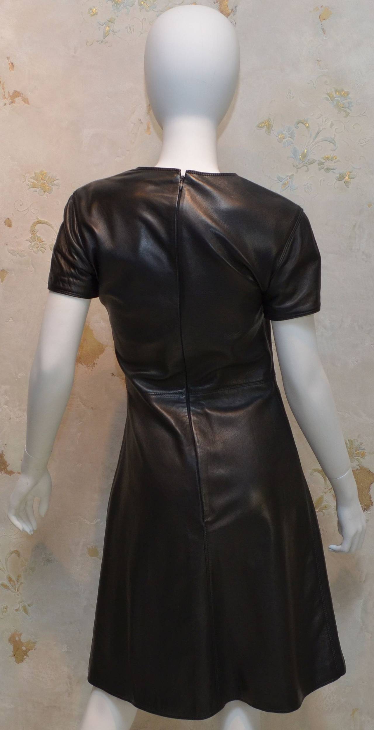 Vintage Gianni Versace Black Soft Leather Short Sleeve Dress features a back zipper closure and is fully lined. 100% genuine leather and made in Italy.

Measurements:
Bust - 34''
Shoulders - 16'' 
Waist - 27.5''
Hips - 39''
Length - 38.5''